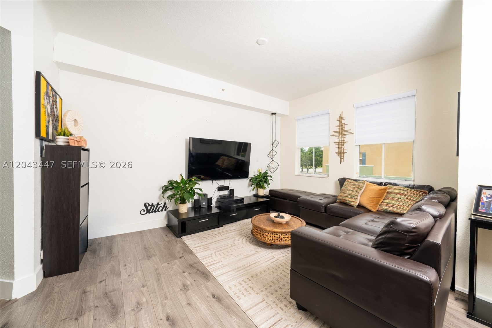Not your average Doral condo. Beautifully remodeled and filled with natural light, this spacious two-story residence offers approximately 1,260 square feet, a highly functional layout, and the separation and privacy of a townhome-style home.
The main level features an open living and dining area, an updated kitchen, a convenient half bathroom, in-unit laundry, and an open balcony. Upstairs, both oversized bedrooms are thoughtfully separated from the main living space and feature their own ensuite bathrooms. The primary bedroom also includes a walk-in closet.

The remodeled interior, generous room sizes, and thoughtful two-level layout make this home stand apart from more dated units in the community. The current parking arrangement provides two unassigned resident spaces, along with guest parking passes, subject to association rules.

Promenades residents enjoy access to their own dedicated pool, along with additional community amenities including a gym, tennis and basketball courts, clubhouse, playground, and walking areas. Conveniently located near the Florida Turnpike, Legacy Park, Downtown Doral, schools, shopping, dining, and everyday conveniences.

Move-in ready, spacious, and thoughtfully updated, this is a home that feels noticeably different from the typical condo in its price range and deserves to be experienced in person.