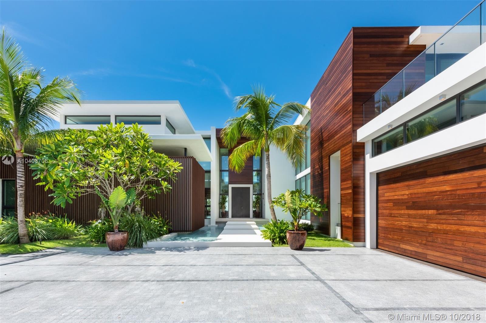 Quality, design, and execution. This new Contemporary home is a result of meticulous planning and precise execution. Perfectly located on the best location within Gated Allison Island. Direct Sunsets, tranquil waters, and vast water-frontage, 110’, offer the best panoramic views the island has to offer. Home features tall custom crafted Mahogany entry, uniquely lacquered fireplace, 22’ ceilings in great room. Bright and open kitchen, custom Italian cabinetry Subzero and Wolf appliances adjacent to exposed courtyard with two 20ft living walls. Butlers kitchen and and staff quarters with dedicated entrance. Individual cellars for wine purist.