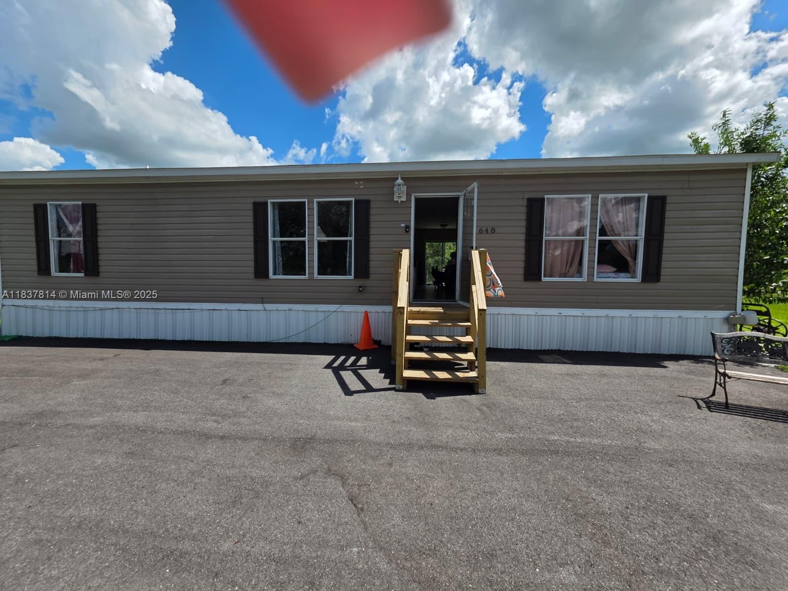 Imagine owning 5 sprawling acres, perfectly suited for your agricultural dreams and family comfort. This exceptional property is not only approved for FHA financing but also offers incredible USDA tax exemptions for all farm animals. 
At the heart of this property is a beautifully maintained 2018 48' x 28' double-wide 3/2 manufactured home with an open-concept kitchen designed for entertainment, no carpets to worry about, and a luxurious Jacuzzi bathtub with a separate shower. A full water treatment system ensures pristine water quality.
Remarkably convenient location: 10 minutes to downtown Clewiston, 90 minutes to Miami in 90 minutes, 1 hour to Palm Beach, and just 2 hours to Disney.