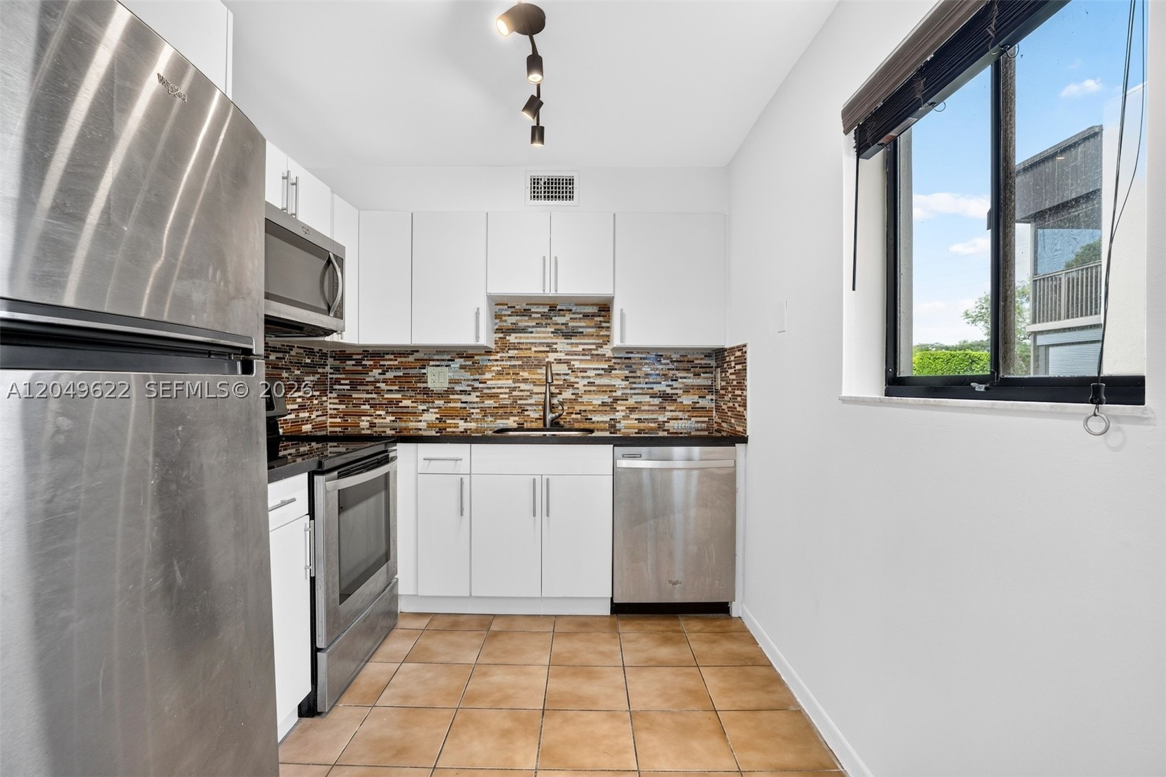 TAMARAC GARDENS CONDOMINI - Residential Lease