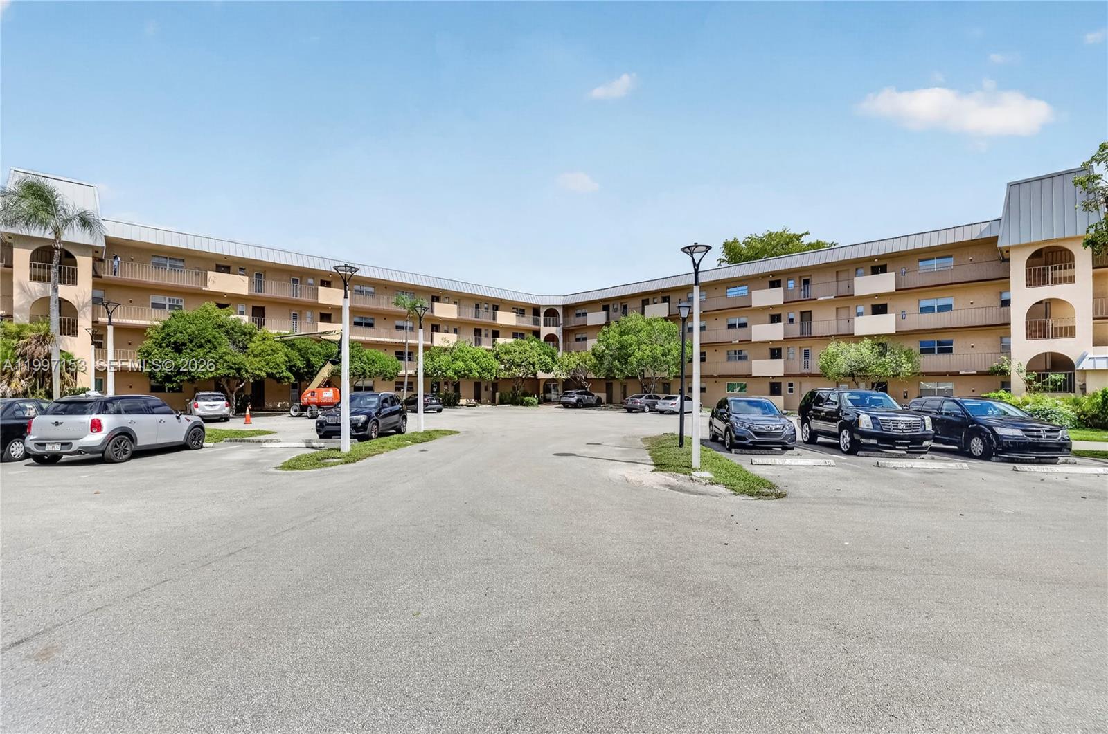 Welcome to this serene, spacious 3-bedroom, 2-bathroom unit! You'll find laminated flooring throughout, a screened balcony with a view of the lush landscape.