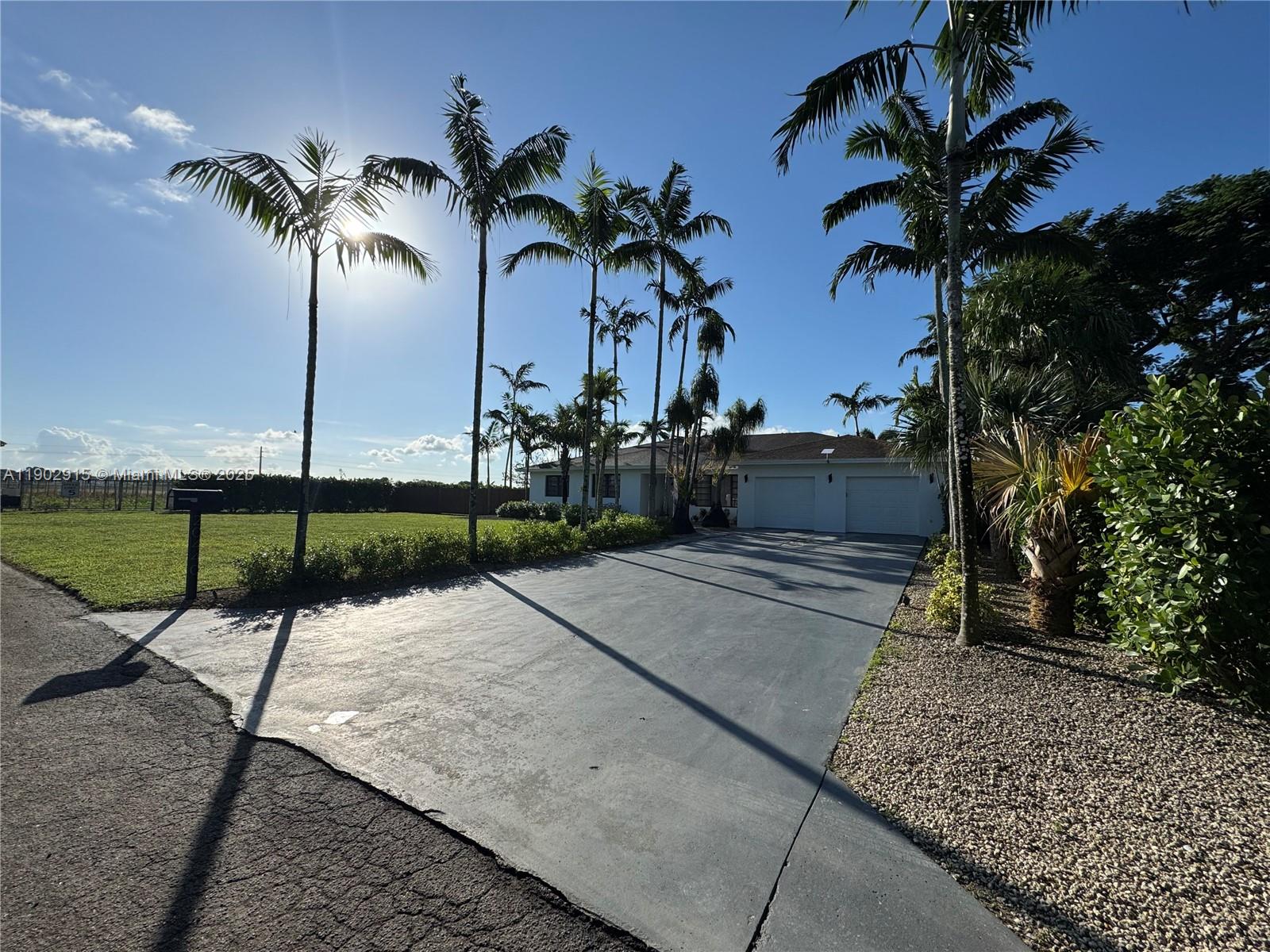 Very unique property nestled at the end of a dead end street, with 8' privacy hedges, ZERO traffic, complete privacy. Entire acre has been redone.  All landscaping, gravel, irrigation, pool resurfaced and upgraded.  Covered 13' tall RV/Boat/Storage with lighting, electrical, and wifi is separated from main house with hedges as well.  Entire house has been updated.  Entire structure exceeds South Florida Buiding Codes to include; Poured concrete shell, over engineered roof structure, Mechanical/Electrical/Plumbing are all to commercial grade specifications.  Oversized septic tank, well with water conditioning, irrigation pump, dual zone AC systems, 4K cameras, and much more.  Too many items to list, must see to appreciate.  Sale is not subject to appraisal.