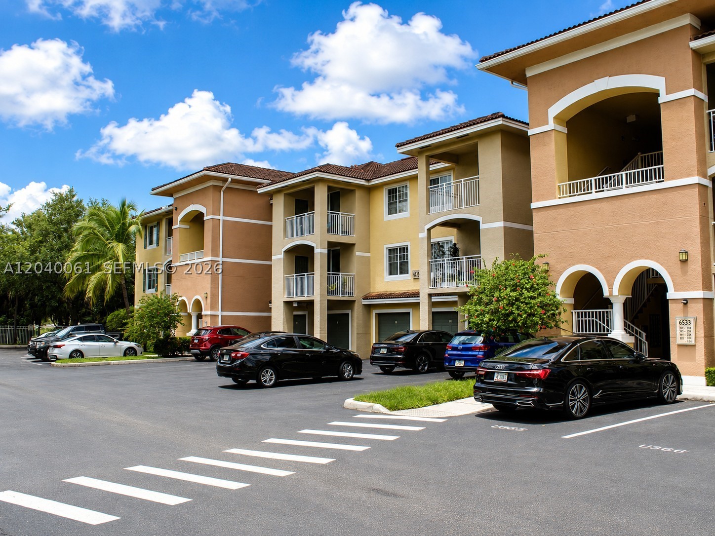 A wonderful opportunity to own at The Villas at Emerald Dunes, one of West Palm Beach's most sought-after gated communities. This bright and spacious 2/2 offers the perfect blend of comfort, style, and convenience. The split floor plan features two master suites with walk-in closets, providing privacy and flexibility for owners, guests, or a home office setup. The gourmet kitchen impresses with granite countertops and stainless steel appliances, and the in-unit full-size laundry room adds everyday convenience. Enjoy Florida living from your private balcony, with hurricane impact windows throughout for year-round peace of mind. Two parking spaces included, one covered. Roofs were replaced community-wide in 2024 with no pending special assessments. HOA covers water, sewer, cable and trash. The resort-style community amenities include two pools, tennis courts, a fitness center and a beautifully appointed clubhouse. This is an excellent option as a primary residence, vacation home, or income-producing investment property. Ideally located just west of Florida's Turnpike and only 20 minutes from Downtown West Palm Beach. A turnkey opportunity in a meticulously maintained community. Schedule your private showing today!
