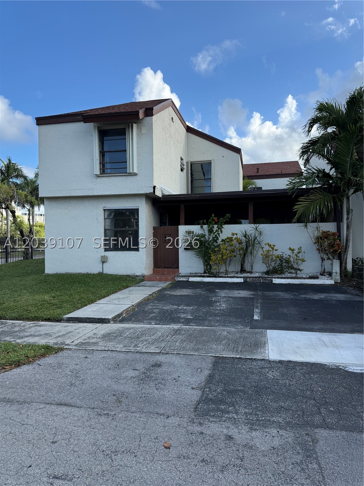 Welcome to this spacious two-story condo/townhome located in the sought-after Fontainebleau neighborhood, offering 1,232 square feet of comfortable living space. The property features 3 bedrooms and 2 full bathrooms, along with a private patio and two designated parking spaces. Additional guest parking is also available. Ideally situated with easy access to the 836, 826, and Florida’s Turnpike, this home is just minutes from FIU, Doral, shopping, dining and entertainment. Interior highlights include two sliding glass doors, a separate utility/laundry room with washer, dryer and generous storage space. The first floor includes one bedroom and one bath, while the second floor offers two additional bedrooms and a full bathroom as well. Residents of East Wind Lake Village enjoy access to a variety of amenities, including swimming pools, tennis courts, a clubhouse, picnic areas, and a scenic community lake.
