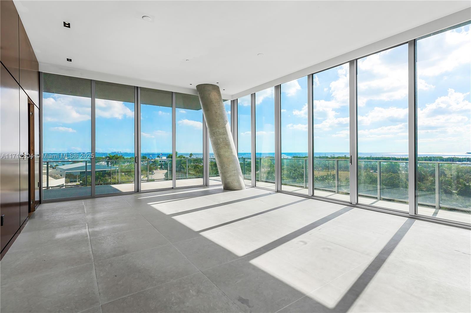 Welcome to Grove at Grand Bay in the heart of Coconut Grove, where luxury meets breathtaking views of Biscayne Bay and Miami’s skyline. This stunning residence updated in 2021, features 5 beds, 5.5 baths, and 4,085 sqft of meticulously designed living space. Arrive at your private elevator to a home with 12-foot floor-to-ceiling glass windows and a 12-foot deep wraparound terrace. The primary bedroom offers ocean views, a spacious walk-in closet, and a luxurious bath. The chef's kitchen is equipped with Miele appliances and Snaidero cabinetry. Enjoy top-tier amenities including a doorman, concierge, private restaurant, spa, gym, pools, tennis court, and more. With assigned parking and valet service, this bayfront high-rise offers the ultimate comfort and convenience.