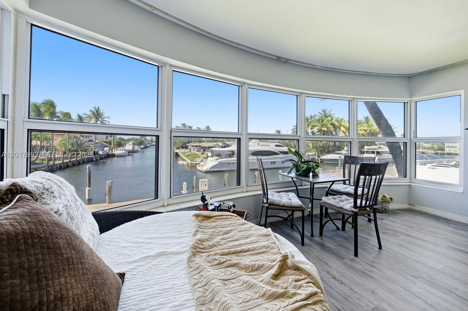 Lowest priced unit! Below market value.  Waterfront paradise.  Stunning waterfront 2 BR/2 BA 1300+ SQ FT. Unit 205E 2nd floor boat-eye-level residence offers the best deep water canal and Intracoastal views with no fixed bridges and easy ocean access. Spacious open layout with incredible water views. Pet and owner friendly community allows 2 pets/unit. Resort style amenities include 3 pools, including 1 heated, BBQ area, water sports storage, private park, and car wash station. Up to 50 ft Boat dockage available to rent. Reserves have been paid current building reserve is funded. All Certification and SIRS have been completed, with recent community upgrades: New Elevators, Dock, Pool and AC water towers, new roof 2025. Rare opportunity to enjoy the ultimate South Florida waterfront lifestyle in a prime location close to beaches, dining, shopping and entertainment.