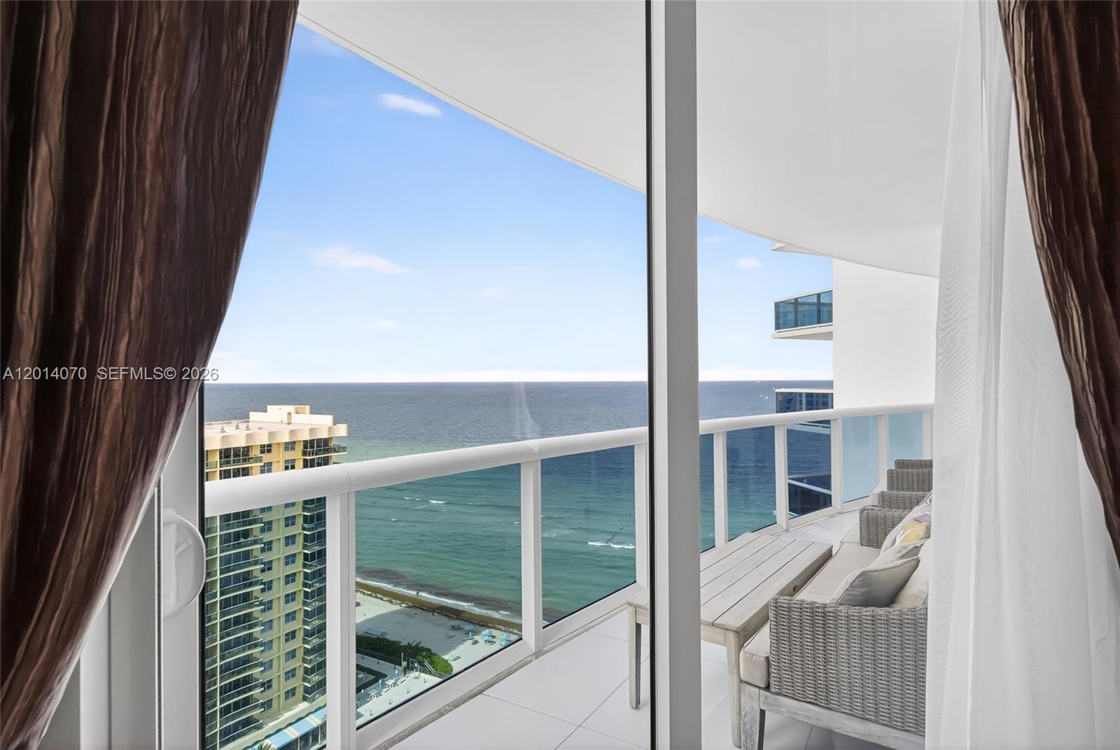LUXURY 3-BEDROOM RESIDENCE AT TRUMP HOLLYWOOD with sweeping ocean and Intracoastal views from the north side of the building. Arrive via private elevator entry to your own foyer, then step into a bright, refined interior framed by floor-to-ceiling glass and two expansive terraces—perfect for sunrise coffee and sunset cocktails. The chef’s kitchen features Miele and Sub-Zero appliances, a wine refrigerator, and sleek finishes, plus a large laundry room with a drop-in sink for added convenience. Trump Hollywood delivers true five-star, oceanfront living with a resort-style pool and beach service, state-of-the-art fitness center and spa, concierge, 24/7 security, social room, wine & cigar lounges, poolside café, and tennis/pickleball/basketball courts. Includes 1 assigned parking space plus complimentary valet—an exceptional Hollywood Beach lifestyle with luxury amenities at your doorstep.