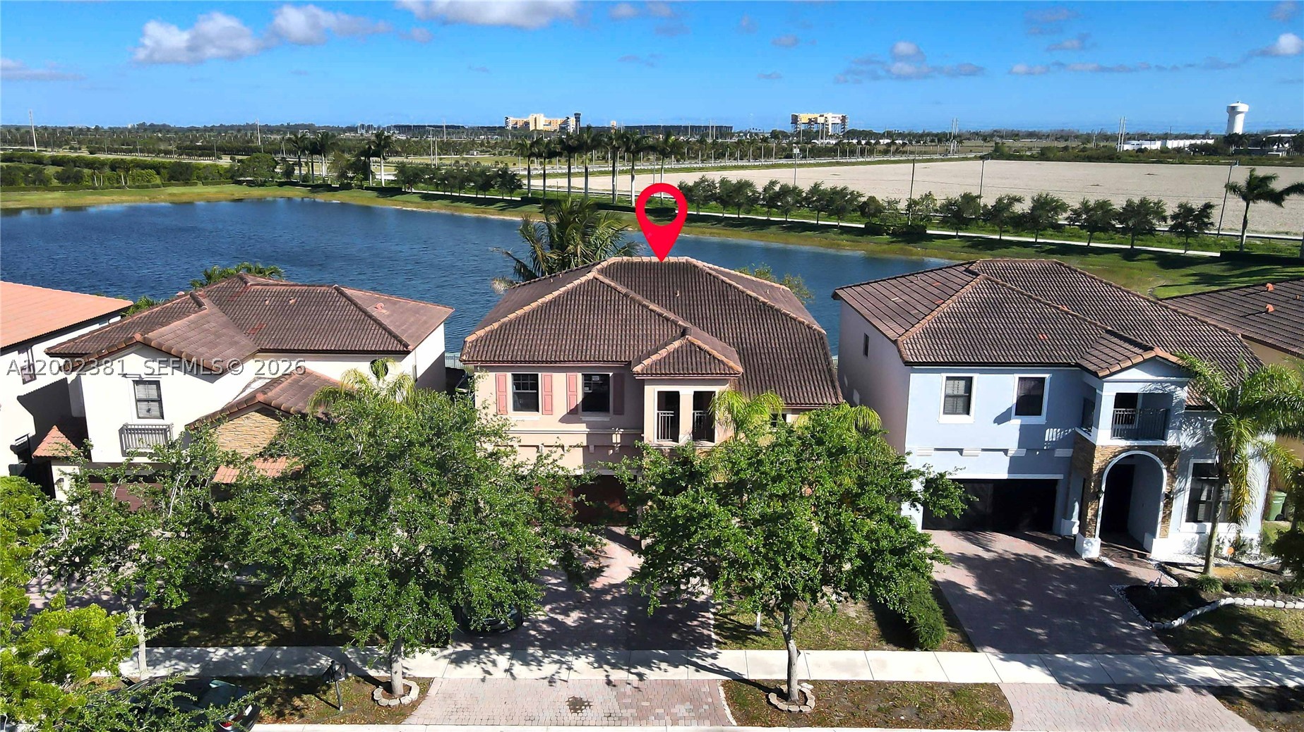 Welcome to your next home in Homestead's lovely Mallorca at The Vineyards residential community. Now offering closing cost assistance to buyers. This property provides a bit over 2,700 square feet of living space in a peaceful community. The design is made to be adaptable to various living needs. You have a complete bedroom and bathroom on the first floor, which is perfect for a multigenerational family, guests, or office space. The remaining bedrooms are located upstairs. In addition, a good-sized loft space on the second level provides multiple usable functionalities. Overall, the home layout provides plenty of living areas, making it your perfect new dream home.  

Go outside and take advantage of the perfect yard to unwind and enjoy a beautiful lake view. This house is in a gated community that is renowned for its peaceful and well-kept surroundings. Pets are permitted in the community, giving homeowners more flexibility. 

The location is yet another significant benefit. You can easily access major hospitals, supermarkets, dining establishments, the NASCAR racetrack, and daily shopping necessities within a short distance. Another plus, Key Largo is only 5 miles away. If you're looking for space, functionality, and a fantastic location, this property is a must-see. Please keep in mind that when booking your showing, we need at least 24 hours' notice.