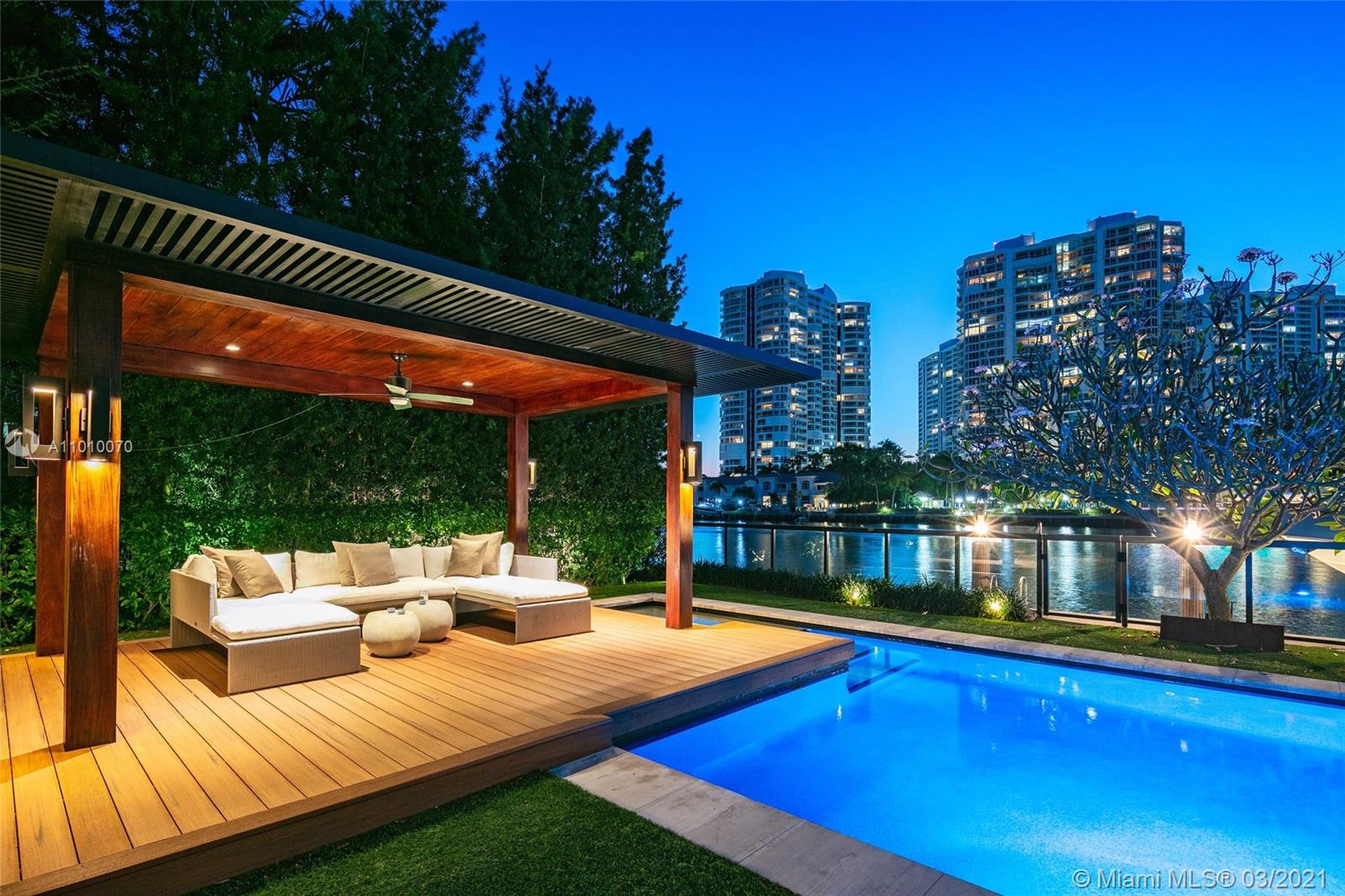 Designed by architect Cesar Molina & interior designer Fanny Haim, this sleek Bali inspired waterfront residence in coveted Golden Beach was rebuilt & modernized in 2012 to perfection. This 2-story masterpiece boasts 6 BR 6+1 BA atop a 16,500 SF lot w/ 100’ on Intracoastal waterway. Perfect for entertaining & boat lovers. Throughout the home’s 7,200+ SF living area are light-filled spaces & natural luxurious finishes maximizing exposure to the outdoors. Downstairs living spaces, kitchen, and bedrooms designed to amplify views. Defining spaces warm up the airy modern floorplan, a casual family room enveloped w/ partial rich walnut lined walls. Blissful outdoor spaces by world-renowned Swiss landscape architect Enea Garden Design feature Orchid filled trees & a rich cumaru-wrapped gazebo.