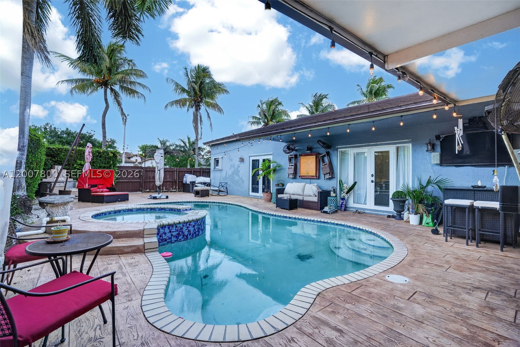 This beautifully maintained 4-bedroom, 2-bathroom home sits on a desirable corner lot and showcases true pride of ownership throughout. Featuring a durable 2019 tile roof, the property is fully fenced and offers ample space for an RV or boat. The expansive outdoor area is designed for both relaxation and entertaining, with a large covered terrace, paved patio, and a fully equipped barbecue and outdoor grill area. Inside, the home boasts a chef’s kitchen with high-end countertops, custom cabinetry, moveable coffee  station, stainless steel wine cooler and matching wine and cigar cabinet and a convenient pot filler, perfect for culinary enthusiasts. The spacious layout flows seamlessly, offering comfort and functionality for everyday living. Step outside to enjoy the heated pool, and heated spa ideal for year-round enjoyment, surrounded by a private, well-kept yard. The master suite includes a beautifully designed bathroom featuring a separate vintage-style clawfoot tub and walk-in shower, creating a spa-like retreat. This home combines quality, space, and thoughtful upgrades, making it a standout choice for those seeking both comfort and style. No Association!!!