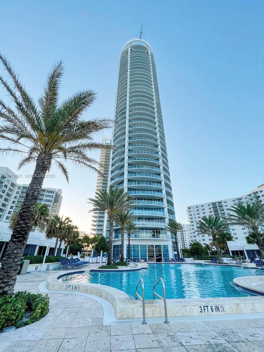 Step into sophistication as your private elevator opens directly into a grand entry hall—your serene transition from the world to your oceanfront sanctuary.
This exceptional residence For Sale features a wrap-around terrace that seamlessly unites the living, dining, and den areas, inviting in the Atlantic breeze and showcasing unobstructed views of both the ocean and Intracoastal.
Offering 2 bedrooms + open den, 3 full bathrooms, a dedicated laundry room, and expansive living spaces, this home blends functional luxury with the prestige of one of Hollywood Beach’s premier towers. Two assigned parking spaces add everyday convenience.
The special assessment for this unit has already been paid in full by the seller, delivering added value and peace of mind.
Indulge in five-star amenities including an oceanfront pool with full service, a world-class spa, and 24-hour concierge—just minutes from elite shopping, fine dining, and major international airports.