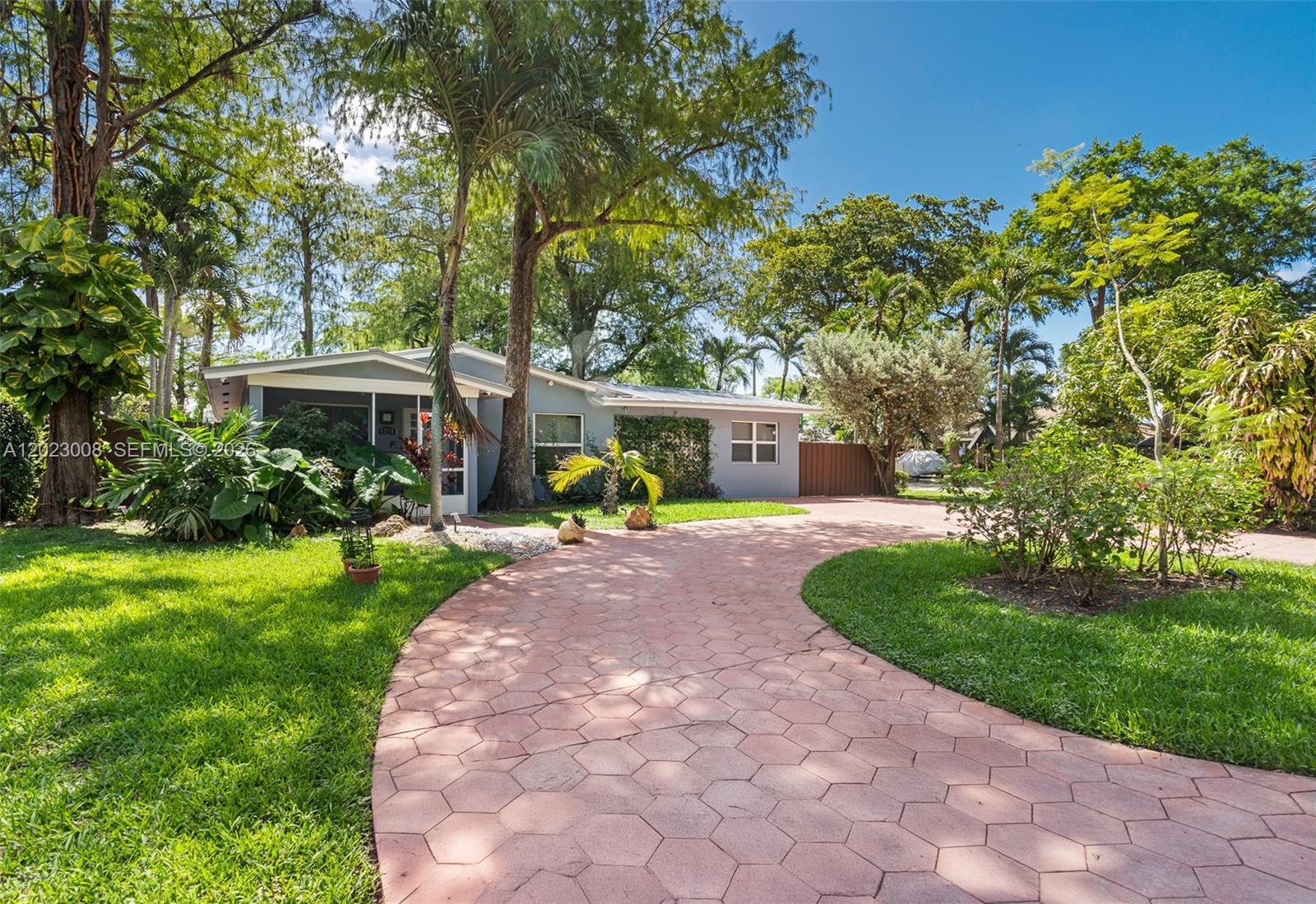 Step into comfort and convenience in this beautiful 3-bedroom, 2-bath single-family home located in the peaceful Tamarac Forest community of Oakland Park. This move-in ready home features textured walls and crown molding throughout, an oversized family room perfect for entertaining, and a stylish kitchen equipped with stainless steel Whirlpool appliances. The primary suite includes custom closets with built-in drawers and shelving, plus modern rolling barn doors. Both bathrooms offer glass shower doors and recessed lighting. Enjoy smart home living with WiFi-controlled lighting, Alexa-integrated automation, and motorized blinds. Energy-efficient recessed lighting has been installed throughout the home. Additional features include central A/C, a laundry room with built-in shelving, hurricane impact windows and doors (2021), and a metal roof replaced in 2025. The outdoor space offers a private concrete patio surrounded by lush greenery, grass, and fruit trees (Mango tree and Banana Trees), along with a privacy fence and outdoor shed. Integrated exterior lighting system. Property also includes a well pump for irrigation, water heater approximately 5 years old, and ample parking with a circular driveway. No HOA and conveniently located near shopping, dining, parks, and major roadways.