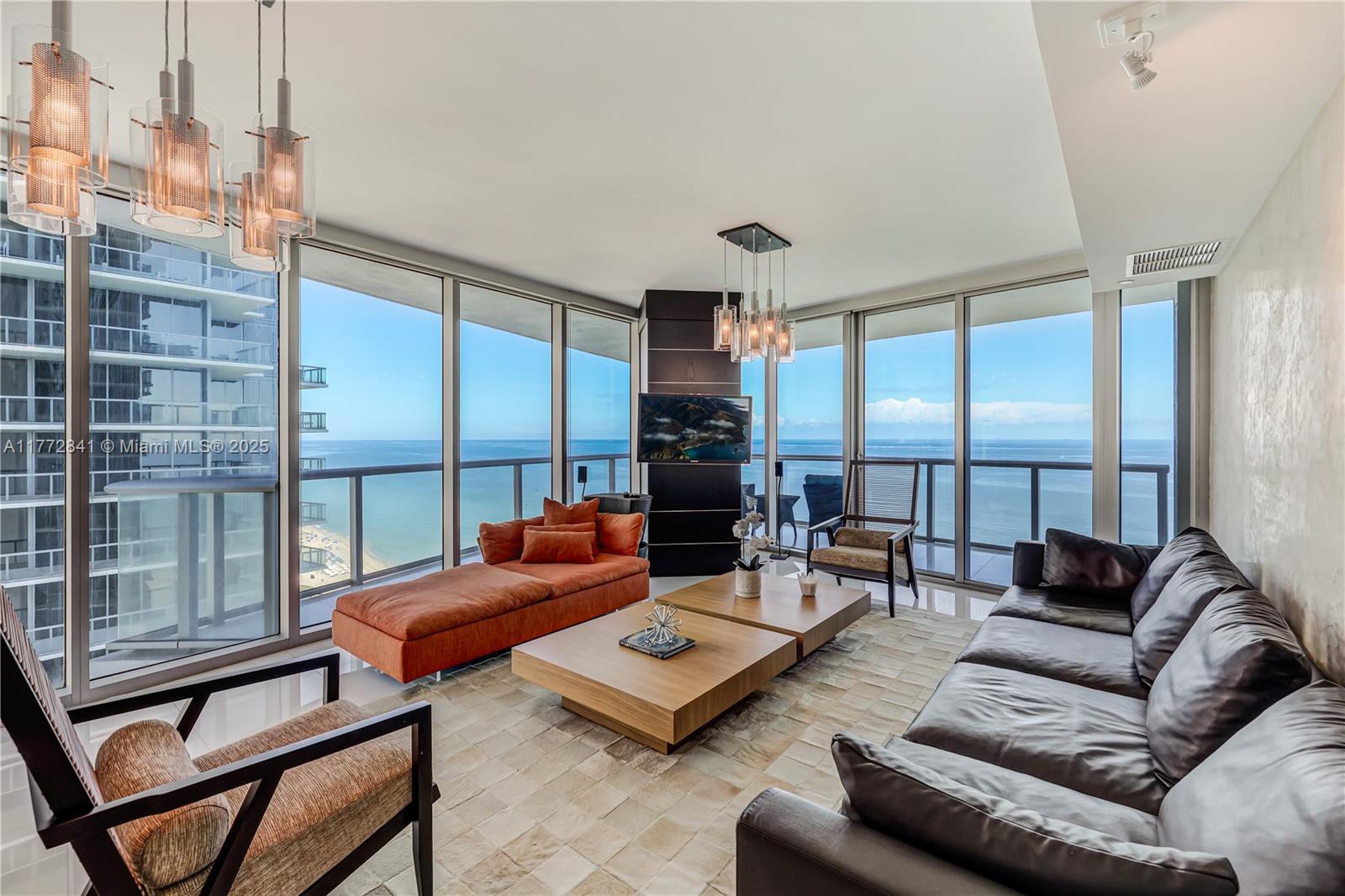 Experience unparalleled elegance in this stunning 4-bedroom, 4.5-bathroom residence at Jade Beach, one of Sunny Isles Beach's most prestigious oceanfront condominiums. Perched on the 25th floor, this sophisticated unit boasts floor-to-ceiling windows, offering breathtaking panoramic ocean and city views. The spacious open-concept layout is enhanced by high-end finishes, Italian cabinetry, top-of-the-line appliances, and smart home technology. Step onto the private balcony to soak in mesmerizing sunrises over the Atlantic. The primary suite is a serene retreat, featuring a spa-like bathroom with a soaking tub, glass-enclosed shower, and dual vanities. Jade Beach offers world-class amenities, unit comes Fully Furnished, with 2 parking spaces + storage