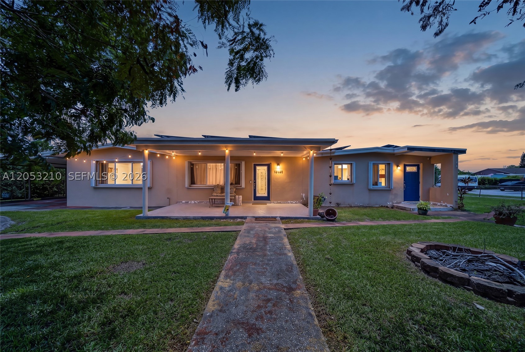 Welcome to this beautifully maintained 4-bedroom, 2-bathroom corner home offering comfort, efficiency, and endless possibilities! Situated on an oversized 9,300+ sq. ft. lot with no HOA, this property provides the freedom to truly make it your own. Inside, you'll find a functional galley kitchen featuring stainless steel appliances, spacious living areas, tile flooring throughout the main living spaces, and attractive wood-look flooring in all bedrooms. A dedicated laundry room adds everyday convenience. Major upgrades include a new roof (2023), tankless water heater, accordion shutters, and energy-saving solar panels that help reduce monthly electric costs. Step outside to the expansive backyard with plenty of room to build your dream pool, create an outdoor entertaining area, or simply enjoy the extra space. Whether you're a growing family, first-time buyer, or investor, this move-in-ready home combines value, efficiency, and a prime corner location with no HOA restrictions. Don't miss this incredible opportunity!