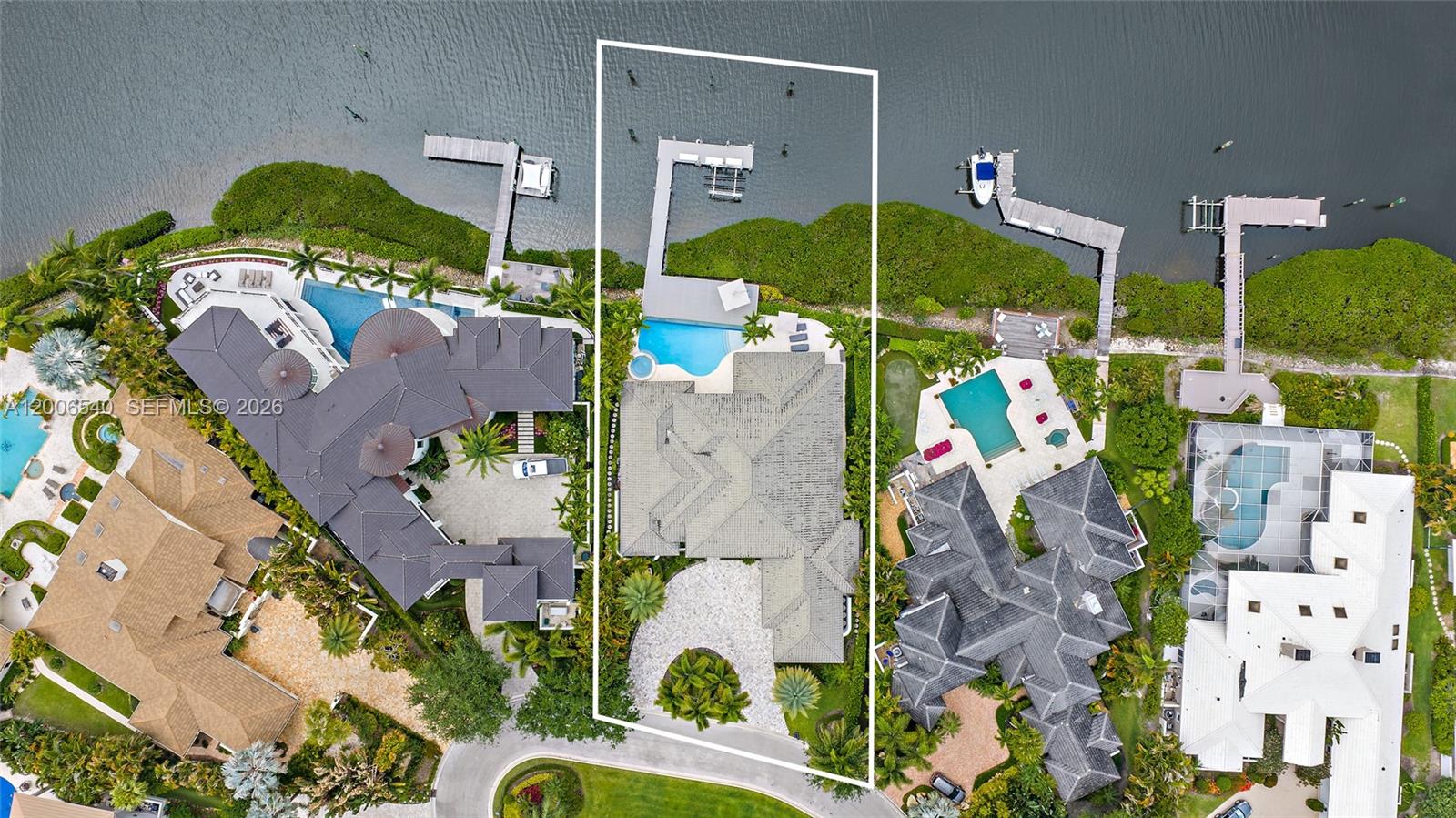 Some of the best views in Admirals Cove. This updated one-story waterfront home captures wide water views with beautiful sunset exposure, creating a setting that is both peaceful and visually striking. With direct ocean access and no fixed bridges, it's well suited for boating enthusiasts. The home is move-in ready, offering the opportunity to enjoy everything Admirals Cove has to offer from day one. Positioned on a cul-de-sac in a prime location close to the gate and club, convenience meets privacy. Admirals Cove is one of South Florida's premier private communities, featuring 45 holes of championship golf, a full-service marina, multiple clubhouses, tennis and pickleball, a state-of-the-art fitness and wellness center, spa, and an active social lifestyle.