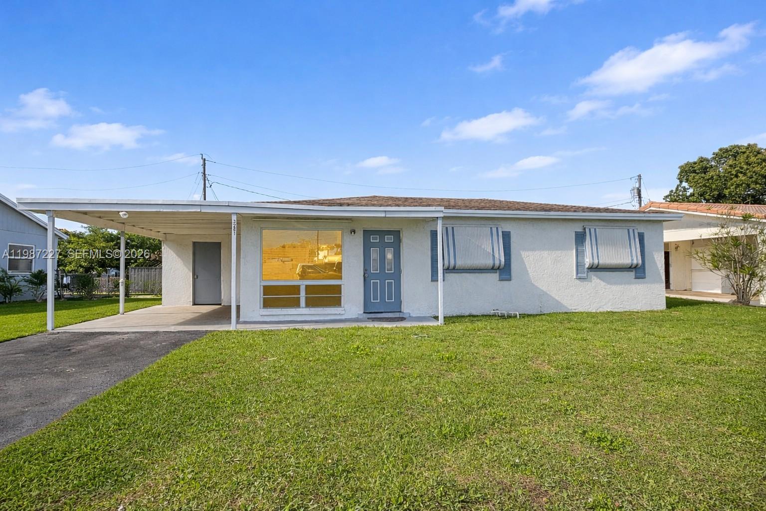 Charming single-story home in the heart of Lauderhill featuring 3 bedrooms and 1 bathroom. This property offers a functional layout with abundant natural light, a spacious living area, and a large front yard. The covered carport provides convenient parking and additional storage. Ideal for first-time homebuyers or investors, this home is located just minutes from major highways, shopping, dining, and schools. No HOA. Don’t miss this opportunity to own in a centrally located neighborhood with strong rental potential.