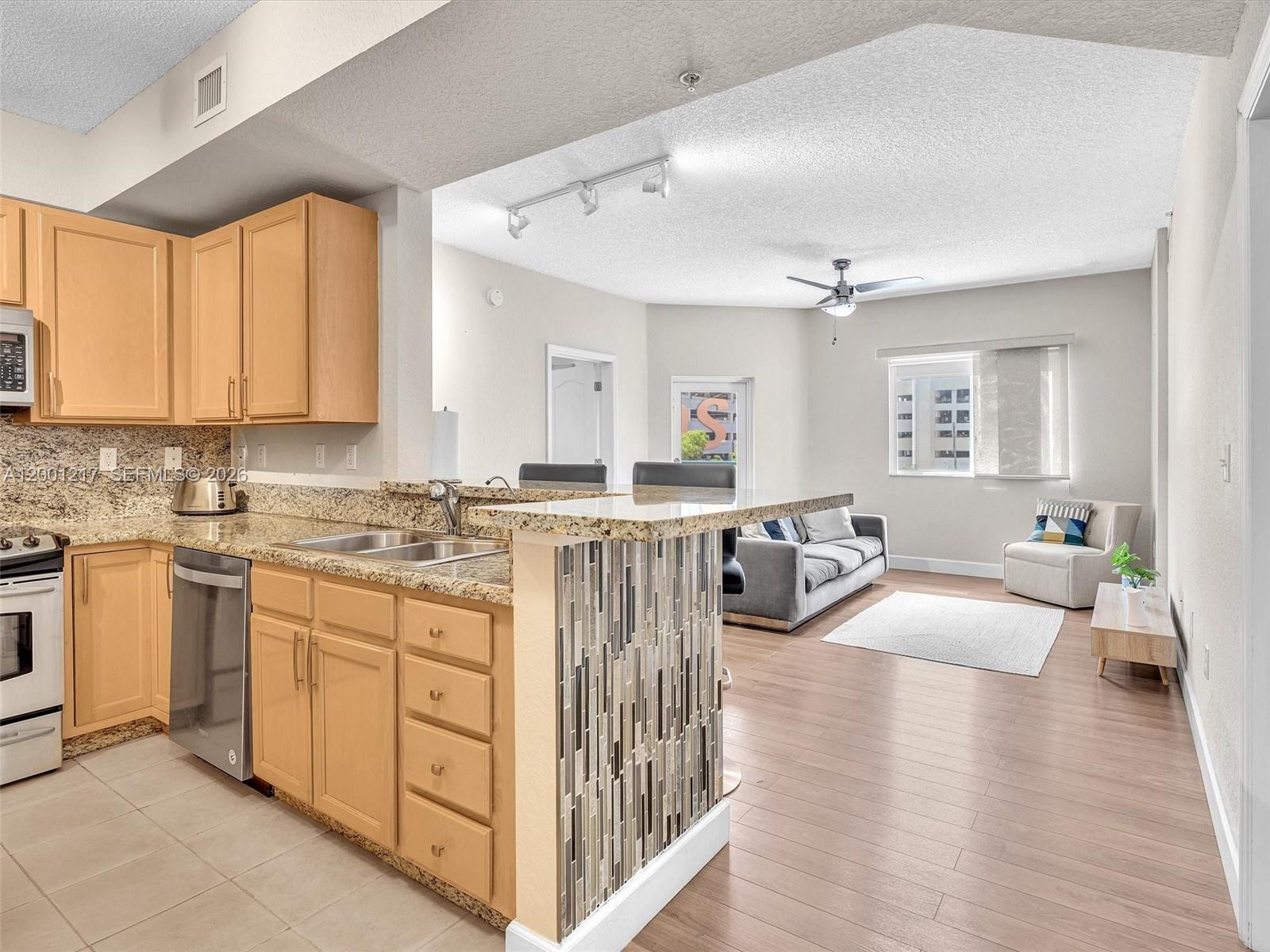 TWO ASSIGNED PARKING SPACES LOCATED ON THE SAME FLOOR AS THE UNIT, SIDE BY SIDE AND JUST STEPS FROM THE BUILDING ACCESS! Move-in-ready, upgraded 2BR/2BA residence, available partially furnished or unfurnished. Highly desirable split floor plan offers privacy for roommates, guests, or family members. Features laminated and tile flooring, HIGH-IMPACT WINDOWS AND DOORS, granite countertops, stainless steel appliances, wood cabinetry, full-size washer and dryer, and a private balcony with skyline views. WALKING DISTANCE TO LARKIN HOSPITAL, SOUTH MIAMI HOSPITAL, AND THE UNIVERSITY OF MIAMI, making this an exceptional opportunity for both end users and investors seeking strong rental demand. Full-service building with attended lobby, security, fitness center, lap pool, zen garden, business center, internet café, clubhouse, billiards room, and BBQ area, and conveniently located near shopping, dining, and the South Miami train station with easy access to Dadeland, Brickell, and Miami International Airport.