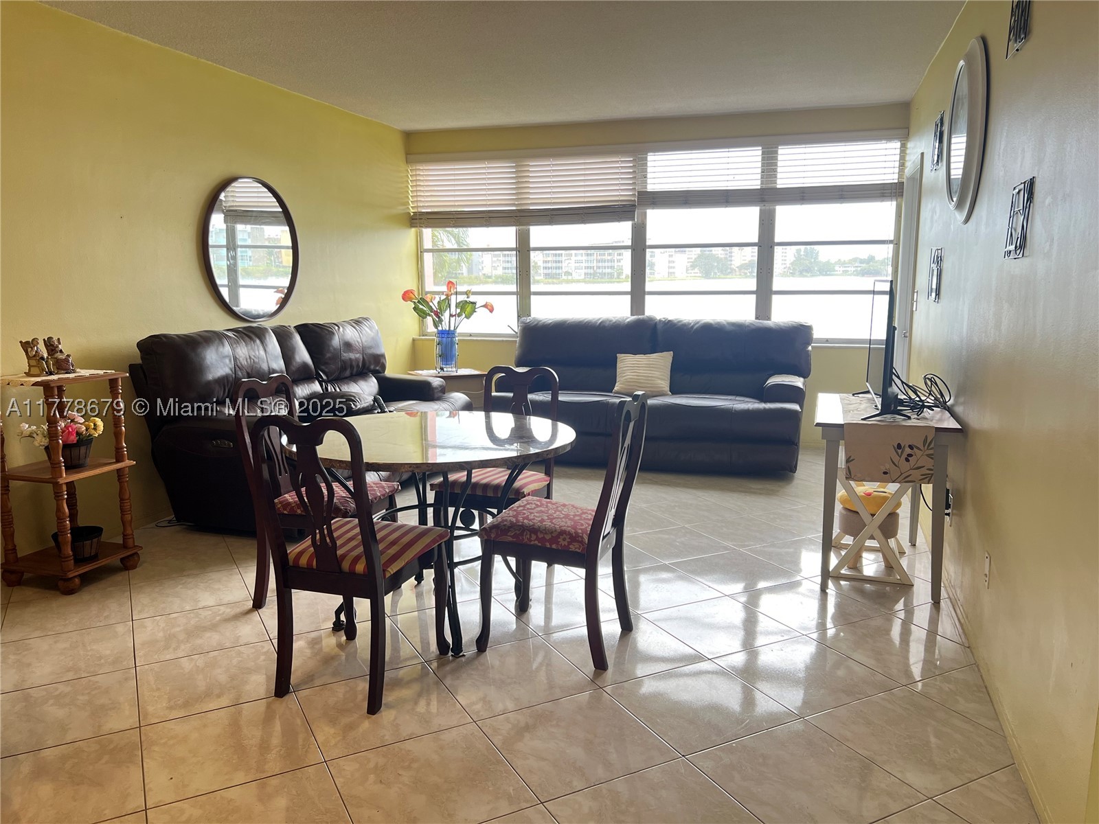 Charming 1/1.5 condo in the 55+ community of Sixth Moorings. This condo could be a perfect fit for you! Beautiful lake views from living room & bedroom. Glassed in porch with lots of potential. Located close to public transportation, places of worship, and Aventura mall. No pets or rentals allowed, 1 assigned parking for the unit right in front of your door. New HVAC in 2019. Remodeled kitchen, updated baths, updated electricity panel in 2015, dishwasher 2022, updated plumbing & electric. Washer/Dryer in unit. Condo comes fully furnished. Piano in living room not to convey. Clubhouse, gym and 2 pools, library also located on site. Call or Text listing agent.