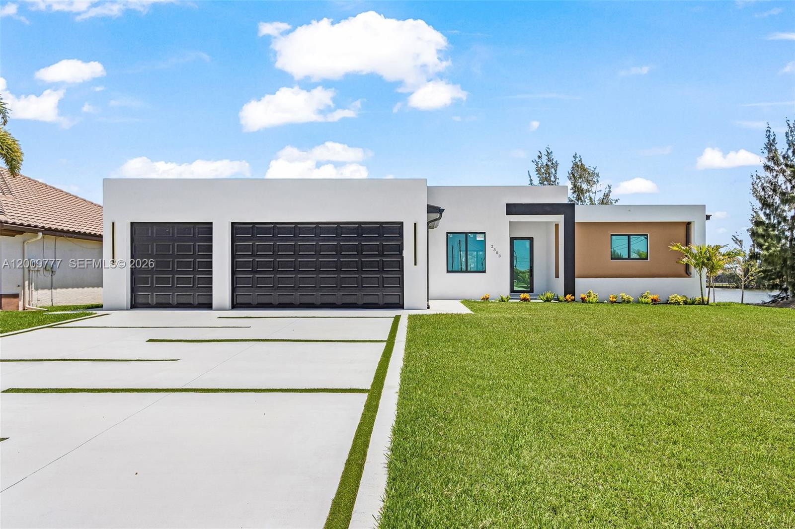 Experience elevated waterfront living in this stunning new construction residence, perfectly positioned on a north-facing canal lot in one of Cape Coral’s fastest-growing areas—with direct boating access to the Gulf. Designed with a focus on sophistication and comfort, this one-story home offers refined living with high-end finishes and seamless indoor-outdoor flow. From the moment you enter, you’re welcomed by expansive living areas, soaring ceilings, and an open-concept design that effortlessly blends the great room, dining area, and a beautifully appointed chef’s kitchen—ideal for both everyday living and upscale entertaining.
The residence features 4 spacious bedrooms and 3+ bathrooms, including a luxurious primary suite with dual walk-in closets and a spa-inspired bath designed for relaxation. Step outside to your private covered lanai with outdoor kitchen, where tranquil canal views create the perfect backdrop for entertaining or unwinding in style. Enjoy the ultimate Florida lifestyle with the ability to dock your boat and access open waters with ease.
Additional highlights include a 3-car garage, impact-resistant windows and doors, and construction elevated above base flood elevation—offering both elegance and peace of mind. A rare opportunity to own a refined waterfront home that perfectly balances modern luxury with true boating lifestyle appeal.