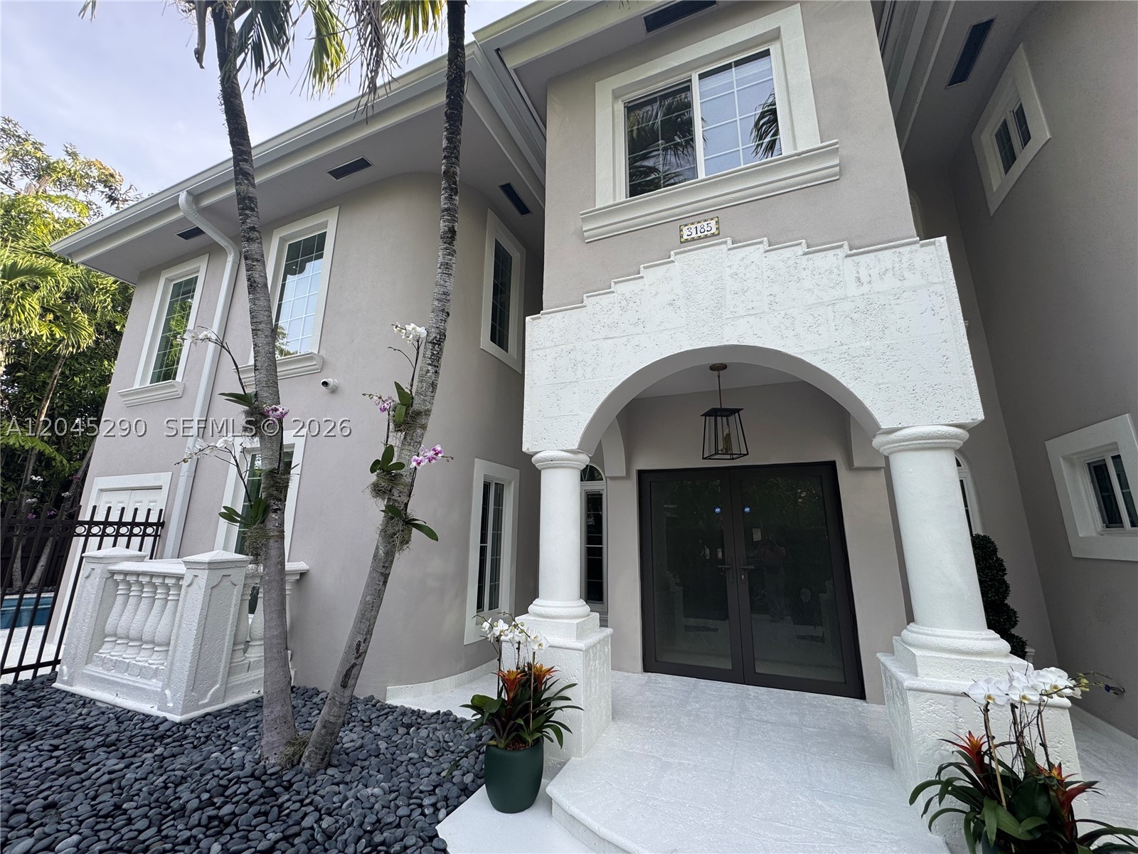 Renovation completed! Perfectly located, Gated Move-In Ready Home! Only a 9 minute walk or 2 minute drive to Ransom. Not located in flood zone. Hurricane impact windows and doors all throughout the home. House is 2001 built. Brand new AC year 2026. Walking distance to Cipriani coffee shop at Mr. C Residences, pilates, Emissary, Sardelle's, Kennedy park, Starbucks, marina, upscale gym's & fitness classes & the most prestigious public & private schools Miami has to offer. It checks all your boxes: 4 large en-suite bedrooms, 4 full bathrooms, 1 den/office space, 2 garages that actually fit cars, & room for all your guests to park. This house has a very well thought out layout/floor plan with no odd additions. Brand new in home infrared red sauna & hot sauna combo directly in your master bathroom. Kitchen is brand new European style kitchen, Miele appliances all paneled. Brand new European style bar underneath the stairs with Subzero wine cooler. European style closets all throughout the home. Bedroom/bathroom on first floor. Balconies in each bedroom. Outdoor gazebo with pool and jacuzzi.