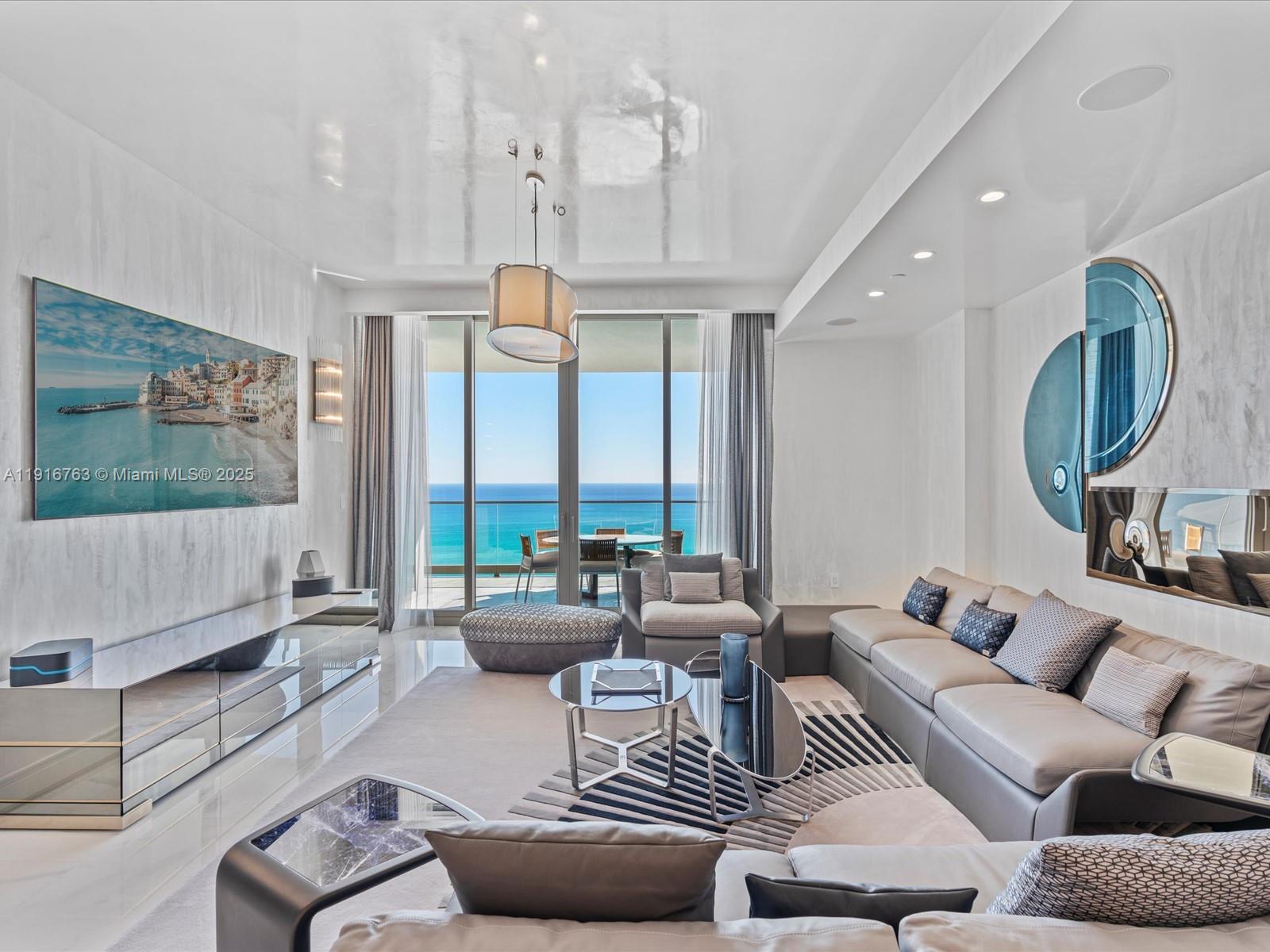 Welcome to an exquisitely finished luxury residence at The Estates at Acqualina. This impeccable flow-through home offers 4 bedrooms, 5 bathrooms, a den, and expansive living areas opening to deep terraces with sweeping ocean and Intracoastal views. Designed with Venetian plaster throughout and furnished with rare Bugatti, Bentley, and Fendi pieces, the residence features Miele appliances, a La Cornue gas range, smart-home automation, electric shades, and dual onyx bathrooms in the primary suite. The Estates provides an unrivaled lifestyle with full beach and pool service, multiple restaurants including Avra, a luxury spa, hammam, world-class fitness center, resort pools, FlowRider, a theater, ice-skating rink, bowling alley, children’s amenities, simulators, and a Rolls-Royce house car.
