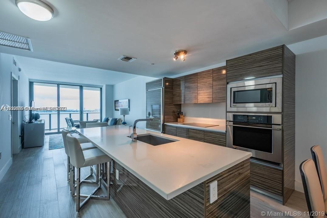 Stunning fully furnished 2 Bed/2Bath condo with pen, unobstructed & breathtaking views of Biscayne Bay & South Beach in the hottest area of Miami, Edgewater. Unit is close to Design District, Midtown Shops and a 5 minute drive to Wynwood and the art district as well as right next to 95. Porcelain floors, beautiful amenities such as heated pool, tennis courts, exercise room, sauna/spa, and a park where you can walk your dog/ exercise conveniently.