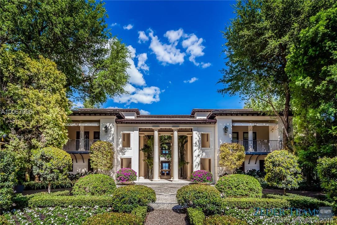 With 155.2 ft. of breathtaking waterfront in the renowned gated community of Tahiti Beach, this opulent 3-story Palladian-style home features unrivaled bay views. Upon entering the Ramon Pacheco/Jonathan Hogg designed home, one is welcomed by a beautifully landscaped serene garden which sets the tone for what is inside. With no expense spared, designer finishes and attention to detail throughout highlight the home while providing unobstructed views of the bay, swimming pool, garden, and 52.3 ft. dock.