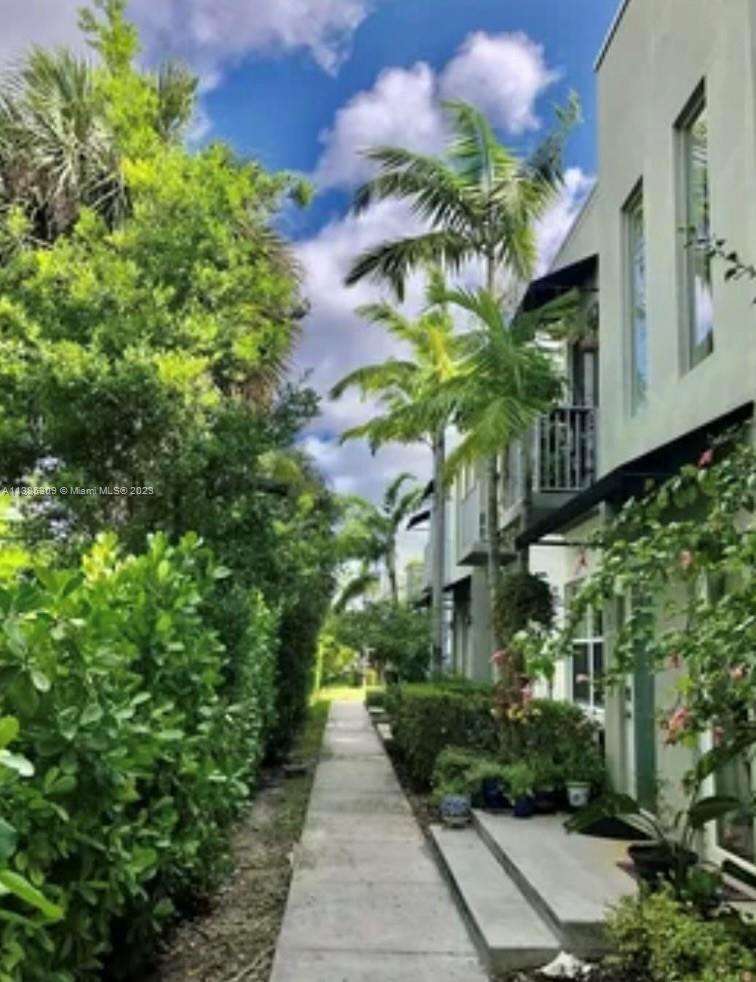 Beautiful 2 bedroom / 2 1/2 bath townhouse with 2 car attached garage and view of the park! Tile and wood floors throughout.  Full-size washer and dryer.   Two master bedrooms suites upstairs. This townhome is located in the friendly and quiet community of Urban Village on 5th. Located in the center of Oakland Park directly across the street from Woodson Park, and a short drive to great restaurants, entertainment, shopping, and just 2 1/2 miles to Fort Lauderdale beaches.  Perfect for entertaining with stainless steel appliances, high ceilings, and ample space for family gatherings. Note:  Documented support animals are permitted.