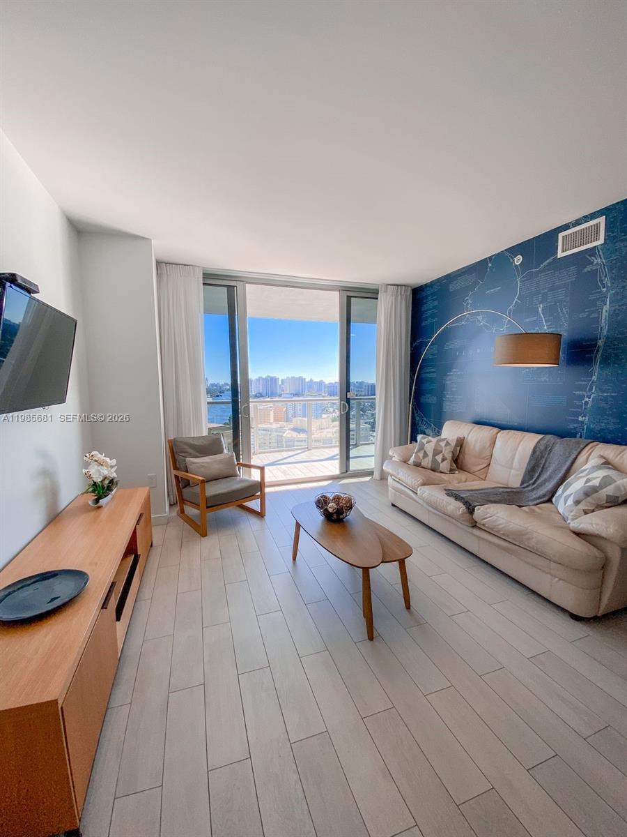 Great investment opportunity or 2nd home!!  Fully furnished 2 bedroom/2 bath with AMAZING water and skyline views.  Unit is unique in that it can be 2/2 or it can be a 1/1 and studio at the same time.   One side offers a one-bedroom residence with a full living and dining area, plus washer and dryer while the second functions as a private studio with its own entrance and bathroom.  Unit flexibility provides more capacity to get many rentals booked.  Daily rentals allowed. Beachwalk Condo-Hotel offers an amazing location in the heart of Hallandale Beach, just minutes from the beach, Aventura Mall, Gulfstream Park, restaurants, shops, and major highways, with convenient access to both Miami and Fort Lauderdale airports.  Full service building that offers 24-hour valet and concierge, a resort-style pool with sun deck, fitness center, on-site restaurant, and complimentary beach shuttle service.