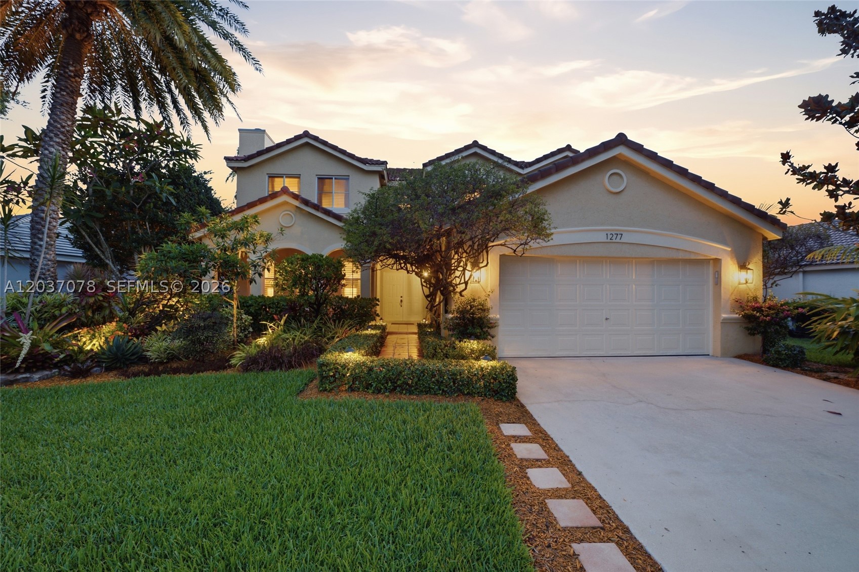 Original owners are saying goodbye to the home they have loved in the gated community of The Meadows. Coral Gables' Mediterranean Revival style. This charming two-story home offers gorgeous curb appeal with mature landscaping, a welcoming front porch, and custom lighting. The fully fenced backyard is a private tropical oasis with lush landscaping, an awning, summer kitchen with Pro-Fire grill, granite counters, night lighting, and a 32x12 heated saltwater pool with spa. Terracotta pavers and a large covered overhang create the perfect setting for outdoor living. Inside, real wood floors flow through the foyer, living room, dining room, staircase, and all bedrooms. The living area features a wood-burning fireplace, crown molding, and plantation shutters. The chef's kitchen captures a warm Coral Gables feel with terracotta floors, shaker wood cabinetry, black leather antique granite, marble backsplash, filtered water, stainless steel appliances, LG refrigerator, and Bosch five-burner induction cooktop. A full bedroom, currently used as an entertainment room, and full bath are on the first floor. Upstairs, the expanded primary suite includes a sitting area, perfect for an office or retreat. The renovated primary bath features a vessel tub, wainscoting, dual sinks, and separate shower. Highlights include epoxy garage floors with cabinets and a work bench, custom lighting, and timeless finishes throughout. Just a walk to community park and more!