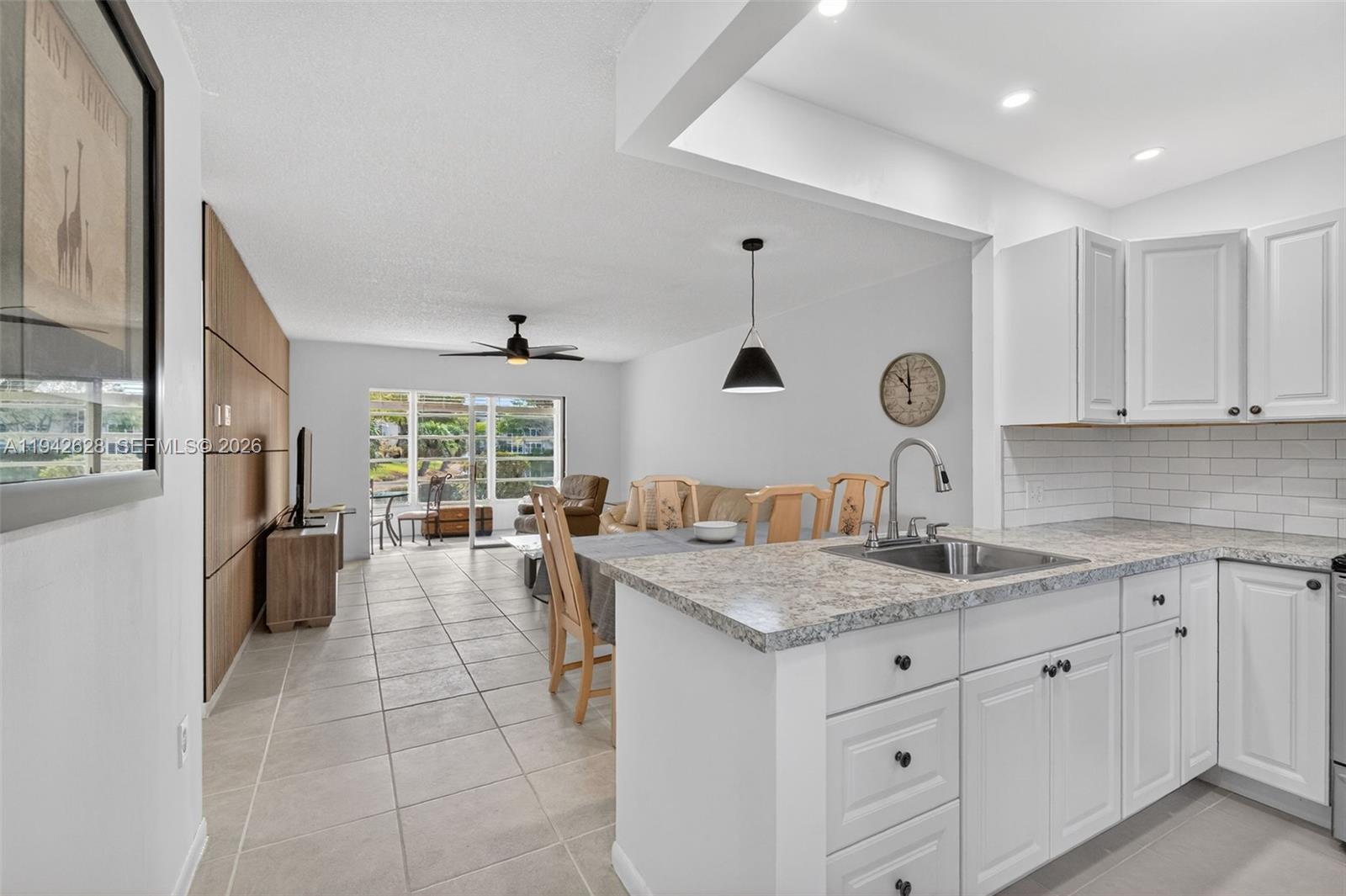 Welcome to this beautiful 2 bedrooms and 2 bathrooms first-floor condo located in the HOPA-verified Community of Hawaiian Gardens, in Phase 4, Clover building. Offered fully furnished and turnkey. this beautifully remodeled unit boasts an open-concept layout with tile flooring throughout.  Opened and completely remodeled kitchen featuring white shaker cabinetry and stainless steel appliances. Both bathrooms were also completely remodeled. Wood accent were added to the living room wall, wow! Great views on the lakes from your balcony or florida room, but also from everywhere. Community offers an impressive array of amenities, including a sparkling pool, community room with full kitchen, fitness center, library, billiards, shuffleboard, pickleball, bocce ball, and so much more. Walk around the lakes, play dards, billard...