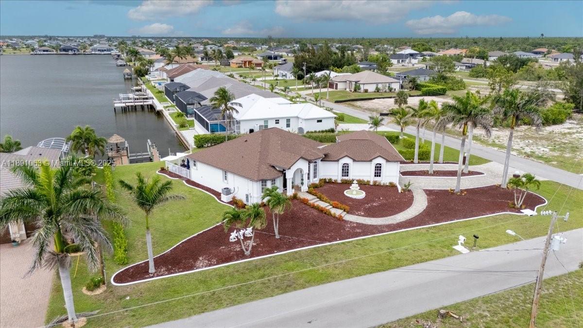 Views of Lupine lake basin, 1/2 ACRE, pool corner house, very Hight front elevation, 4 car garage, one can be for RV, gulf access no bridge (s), water direct, two master bedroom, shutters, some are electric shutters, the gazebo permit is on process, new roof 2020 new front door 2023. Turnkey.
