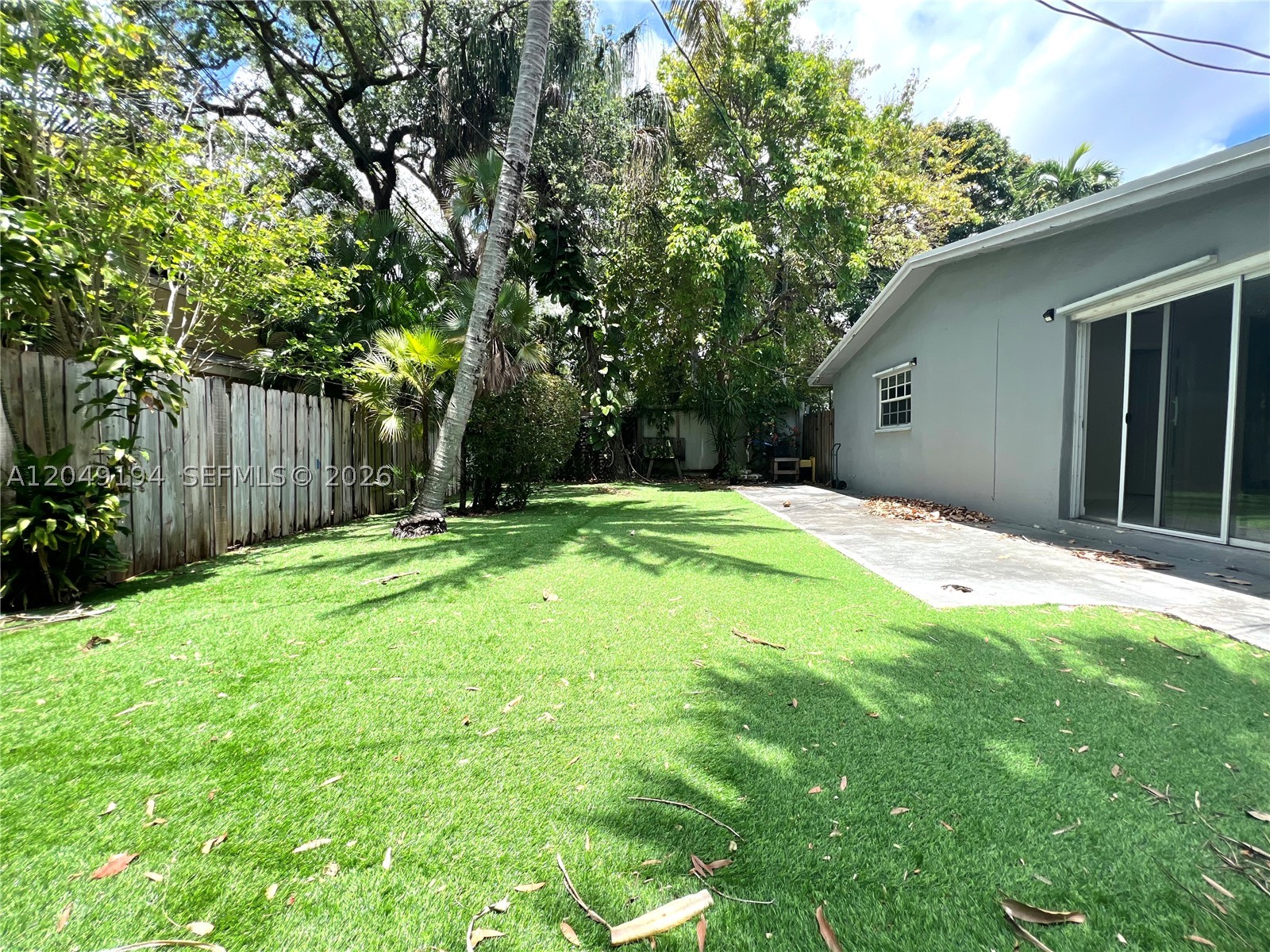 Live in this updated two bedroom/one bathroom apartment with laundry and private outdoor space! Tucked away on a quiet tree lined street, this apartment features floor to ceilings windows, an open floor plan, kitchen with breakfast bar & window, and full size appliances. The gigantic backyard is ideal for entertaining, lounging around, or relaxing in the sun! Each bedroom fits a queen and furniture. Pet friendly! Parking provided on-site. Contact anytime day or night to schedule a viewing!