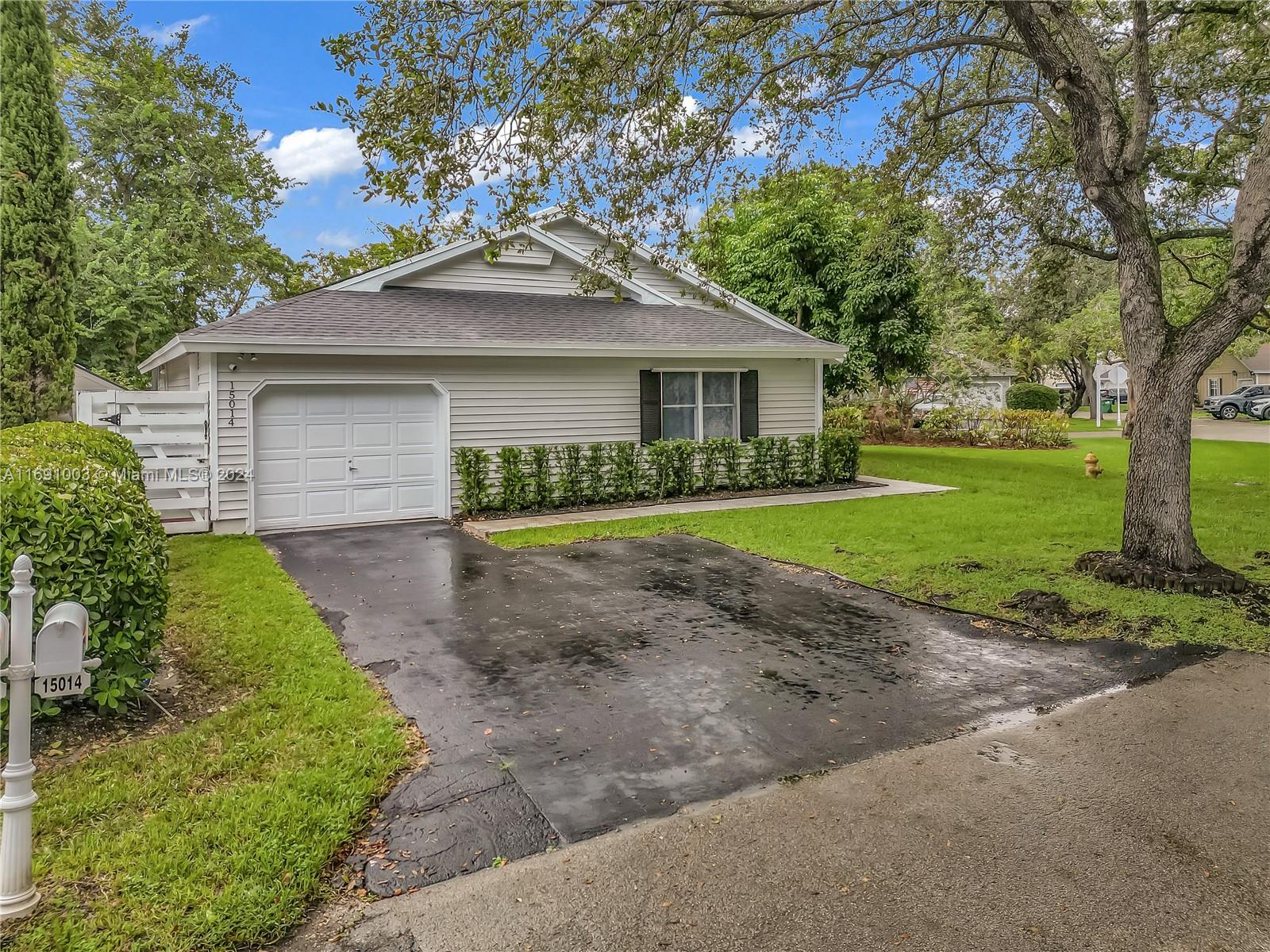 Welcome to this stunning 3 bedroom, 2 bathroom corner lot home in the quiet and peaceful neighborhood of Country Walk. New Roof with Solar Panel that convert this home to Eco-friendly and energy-efficient with Tankless electric heater, new washer and dryer, Insulated automatic garage door and a Camera system around the house for added security. Enjoy your screened Patio with wooden deck and BBQ area perfect for grilling and entertaining guests. The driveway can accommodate 4 cars and its a short walk from the community Rec Center and Lake.