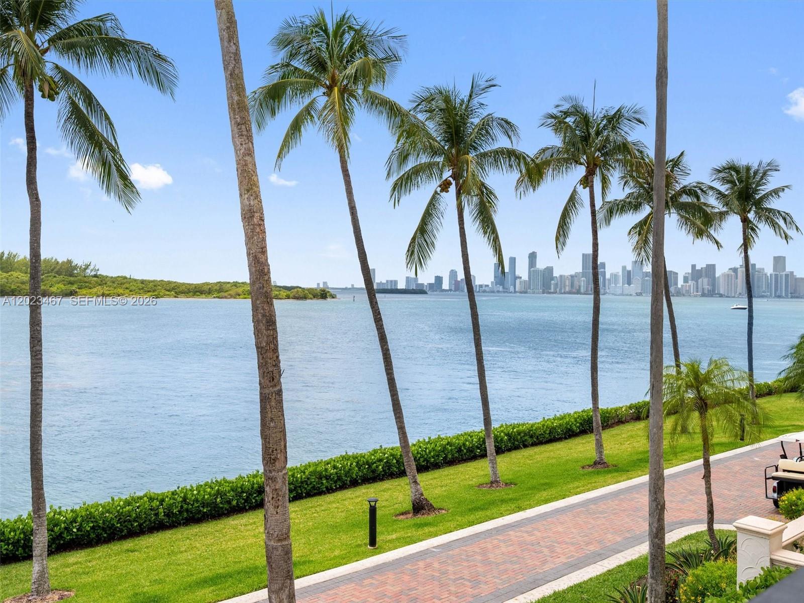 Live the Fisher Island lifestyle in this renovated Bayside Village condo on Fisher Island! This residence showcases 2 bedrooms + 2.5 baths, offering breathtaking views of the Miami downtown skyline, Virginia Key, and Biscayne Bay. Features include 1,912 sq ft interior, an open layout with an updated gourmet kitchen, granite countertops serving as the centerpiece for sophisticated gatherings, a primary suite with a walk-in closet, updated bathrooms, California closets, marble and tile floors that flow elegantly throughout. Visit this exceptional unit where tranquil bayside serenity meets the vibrant energy of the city, only moments away.