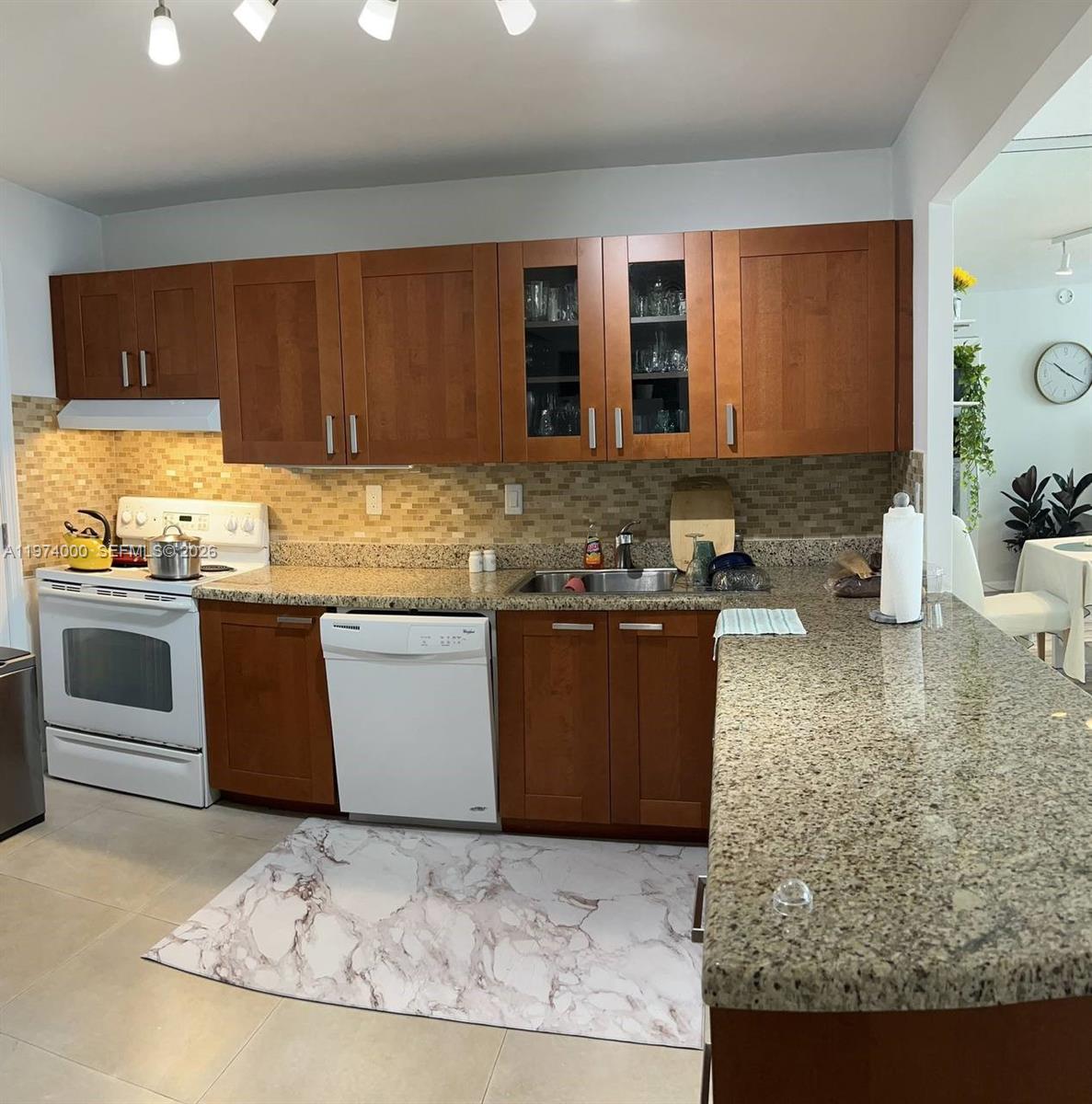 Spacious 1 Bed / 1.5 Bath residence with serene canal views. Includes a flexible office/den space ideal for a home office or guest area. Brand-new impact windows provide security and energy efficiency. Located in a prime area just minutes from Publix, shopping, dining, and major highways. Excellent opportunity for both end-users and investors. Priced to sell and will not last. Tenant occupied. 24-hour notice required for showings. For showings, please contact Listing Agent.