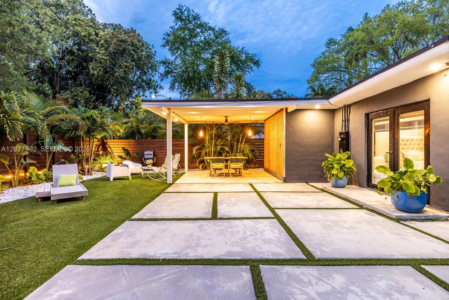 Move right into this exquisitely renovated 3/2 residence in Miami’s highly desirable Upper East Side. Designed with a modern open-concept layout, the home showcases a stunning chef’s kitchen, designer bathrooms, premium finishes, and abundant natural light throughout and gated parking for 3 vehicles. Recent upgrades include impact windows and doors, updated electrical and plumbing systems, air conditioning, and beautifully curated indoor and outdoor spaces. The private backyard offers the perfect setting for entertaining or creating your own tropical retreat. Ideally located just minutes from the vibrant MiMo District, renowned dining, boutique cafés, the Miami Design District, Wynwood, Biscayne Bay, and Miami Beach. A rare turnkey opportunity combining style, location, and effortless South Florida living. NO FLOOD ZONE