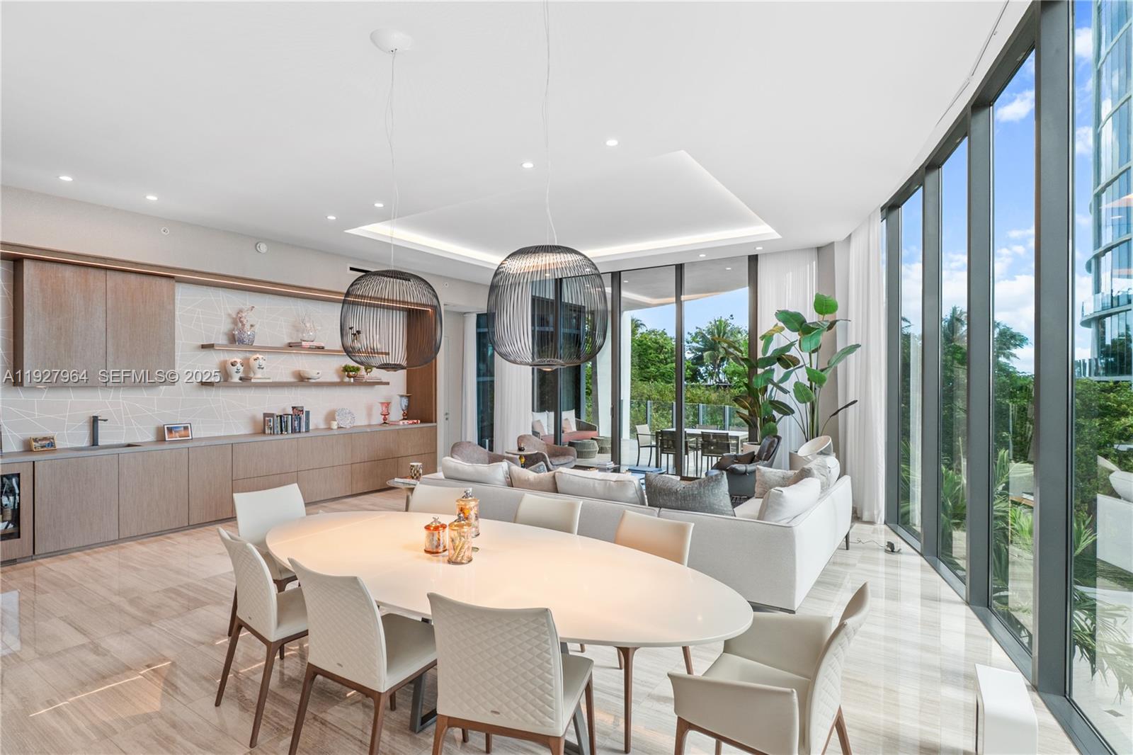Sophisticated 4-bed + den residence at Park Grove T2 with 3,233 SF of refined living, 5.5 baths, soaring 12-ft ceilings and a spacious terrace overlooking Biscayne Bay, the pools and lush gardens. Designed by William Sofield, the home offers a beautifully appointed Poliform kitchen, spa-quality bathrooms, elegant marble floors, custom designer wallpaper, all en-suite bedrooms, his-and-her closets and premium Sub-Zero, Miele and Wolf appliances. Residents enjoy resort-style amenities including 24/7 concierge and butler service, private cabanas, multiple pools, a dining room, library, screening room, fitness center, yoga spaces and a wine cellar, plus a large laundry room and two parking spaces.