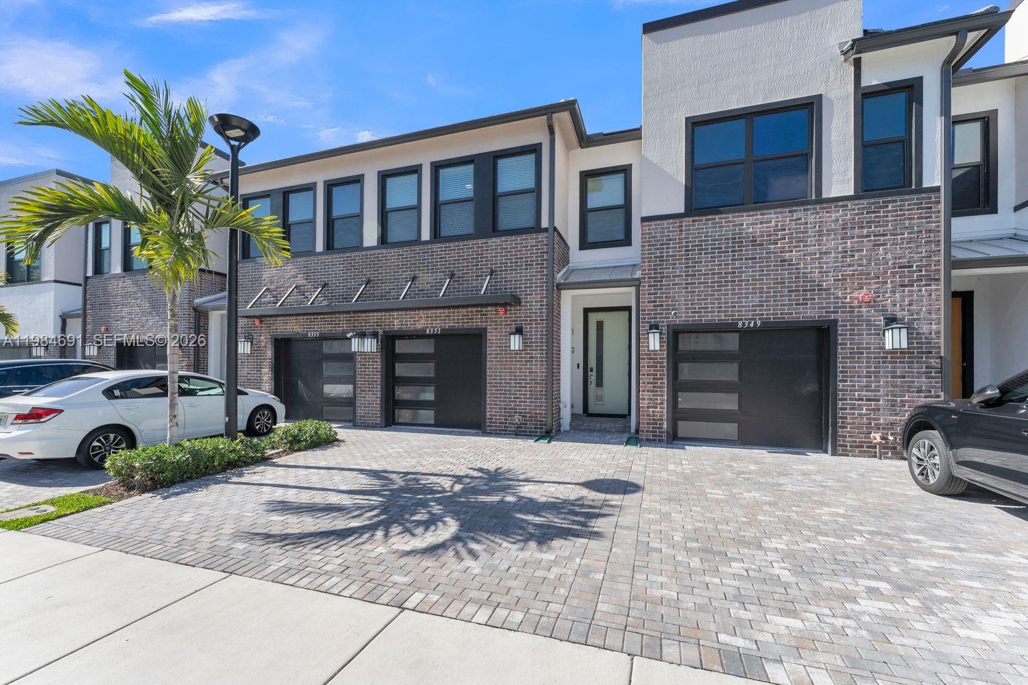 Welcome to 8351 NW 7th Ct, a newly built 2024 townhome in the gated Emory Townhomes community in Plantation. This modern 3-bedroom, 2.5-bath residence by Pulte Homes offers 1,901 SF of bright, open living space, enhanced by the seller’s highest upgrade package, including elevated second-floor ceiling heights.

The main level features an open-concept layout with spacious living and dining areas, tile flooring, and a sleek kitchen with stainless steel appliances, ample cabinetry, and a large center island. The gathering room opens to a private backyard, ideal for indoor-outdoor living.

Upstairs, the primary suite includes a custom built-out walk-in closet and ensuite bath. The second bedroom also features a custom closet, while the third bedroom offers flexible space for guests or a home office.

Additional highlights include impact windows, second-floor laundry, a 1-car garage, and a 2-car driveway. Built in 2024 with builder warranties still in place.

Amenities include a dog park, pool, BBQ area, and lounge spaces in a gated setting. Located near top-rated schools, shopping, dining, major highways, and FLL Airport.