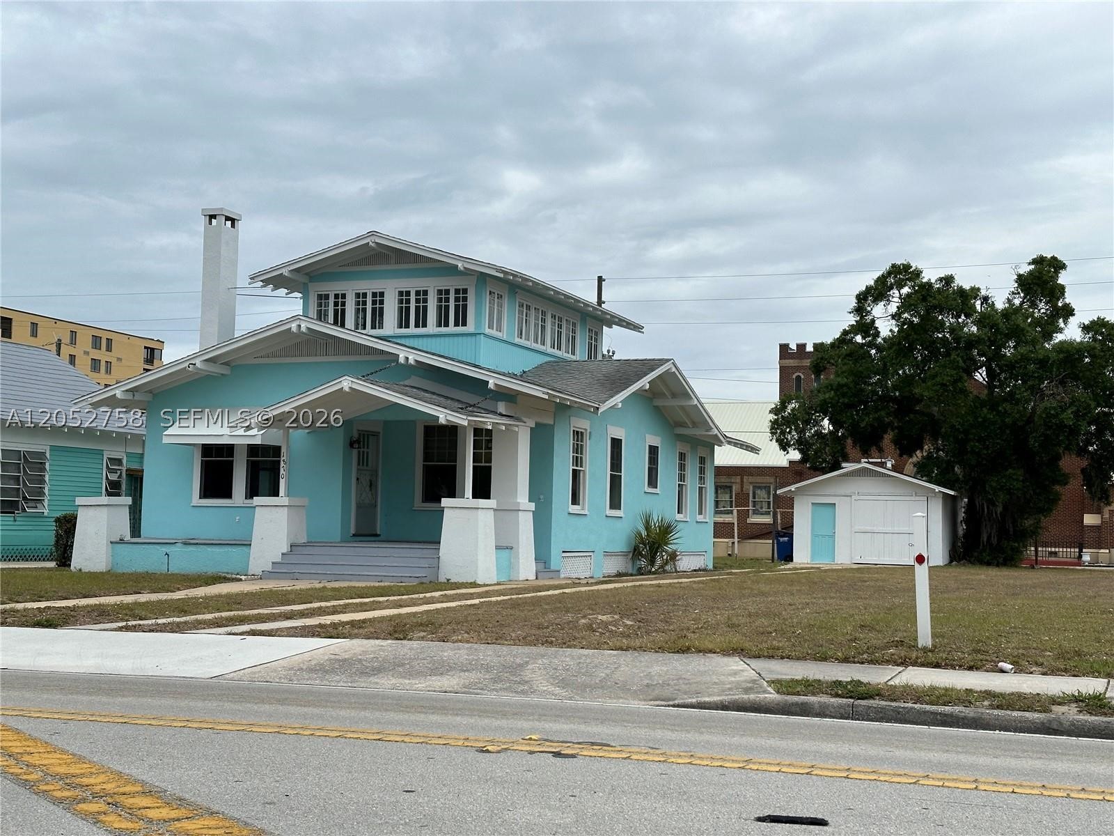 3/2 Home with 1/1 converted garage. GREAT LOCATION! This charming craftsman home is located a block from the library, pier, theater and close to the historic downtown circle with all the events it has to offer. Two stories with a nice sized front covered porch. Living room has fireplace and built-in bookshelves. Breakfast nook has built-in table and seating and china cabinet. Kitchen has been updated with newer cabinets and appliances, stove is gas. Nice sized pantry in kitchen.