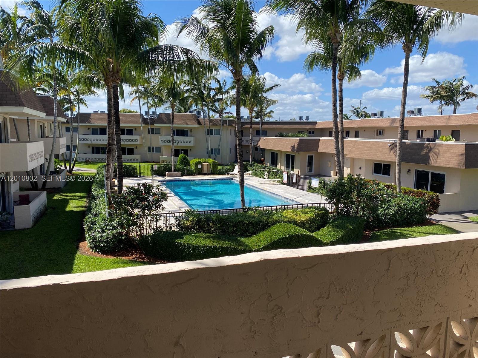 Freshly painted in white one bedroom one bathroom in sought after Palmetto Bay. Gated community for security. Second floor unit with wonderful view of pool and lush garden area. Updated kitchen with wood cabinets and granite counters and stainless steel appliances. Impact windows and doors. Tub in bathroom. Ample balcony off living/dining room facing west to enjoy the garden, pool, and peaceful sunsets. 2 closets including a large walk-in. Excellent location walking distance to Publix and very close to many shops/restaurants including The Falls. Parking space is number 103. Laundry is located on same 2nd floor.