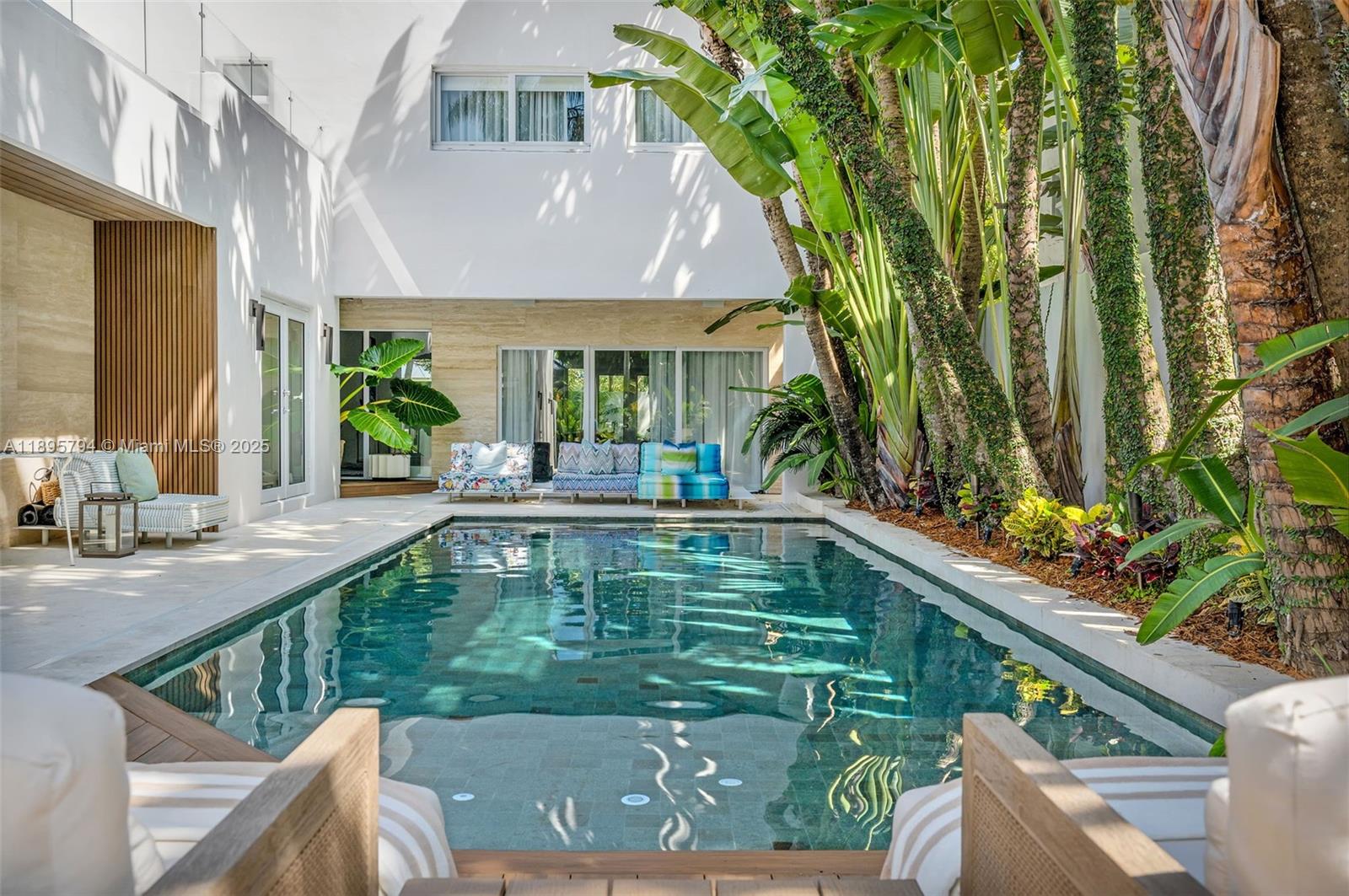 Meticulously remodeled 4Bedrooms/4 Baths sanctuary in prime Coconut Grove. Nestled on a quiet residential street, just moments from Kennedy Park, top-rated schools, and marinas. With 3,400 SF, the main house features 3 beds, 3 baths, an office, and a family room. The heart of the home is a gourmet Italian designer kitchen with stunning marble countertops, flowing into an open-concept living area perfect for entertaining. A unique rooftop terrace provides access to a separate large guest studio, with its own bathroom and kitchen ideal for in-laws or visitors.?A resort-style backyard oasis sparkling pool with exotic Sukabumi natural stone is complemented by a designed composite wood deck and a built-in BBQ station with a Natural Dubai Quartzite countertop. Includes a 2-car garage.