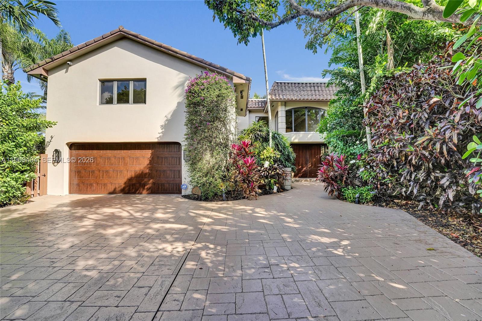 Hidden gem in Emerald Hills where prestige meets privacy. Nestled on a rare point lot at the end of a quiet cul-de-sac with tranquil lake and fairway views, this stunning 5 bedroom 6 bathroom residence delivers effortless indoor-outdoor living. The grounds feature mature landscaping and a private swimming pool, creating a true backyard oasis. The perfectly curated chef’s kitchen is the heart of the home featuring a stunning 22’ quartzite island, top-of-the-line appliances, wine fridge, and coffee station. Soaring ceilings, expansive living areas, and multiple flexible spaces create the perfect setting to gather and grow. The primary suite offers multiple sitting areas, a fireplace, dual walk-in closets, and balcony access, plus a serene bathroom complete with free standing soaking tub, dual shower, two private water closets. Impact windows and doors, newer roof, full-home gas generator.
