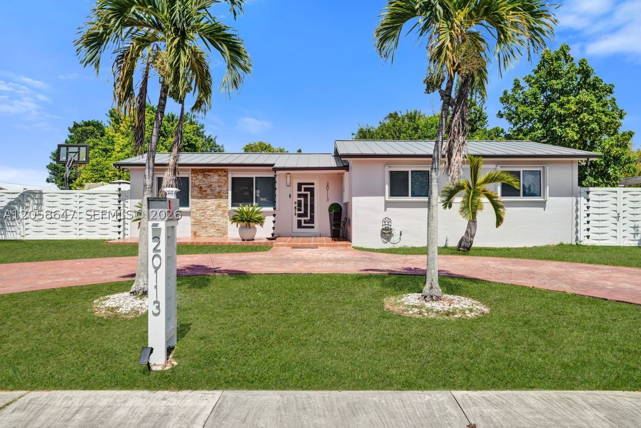 Beautifully remodeled 4-bedroom, 3-bathroom residence offering the perfect blend of modern style, comfort, and functionality. Situated on an expansive 9,775 sq. ft. lot, this move-in-ready home features over 2,100 sq. ft. of total living space designed for both everyday living and entertaining. Step inside to discover a bright, open layout with elegant new flooring throughout, a stunning remodeled kitchen with contemporary finishes, and beautifully updated bathrooms that add a touch of luxury. A brand-new roof provides peace of mind, while the spacious split-bedroom floor plan offers privacy and flexibility for families or guests. Outside, the oversized yard offers endless possibilities to create your dream outdoor oasis, with ample room for a pool, boat, RV, or future entertaining area. The attractive curb appeal, mature palm trees, generous driveway, and modern exterior make a lasting first impression. Conveniently located near top-rated schools, shopping, dining, parks, and major highways, this exceptional home combines quality upgrades with an ideal location. A rare opportunity to own a beautifully updated property that's truly move-in ready.