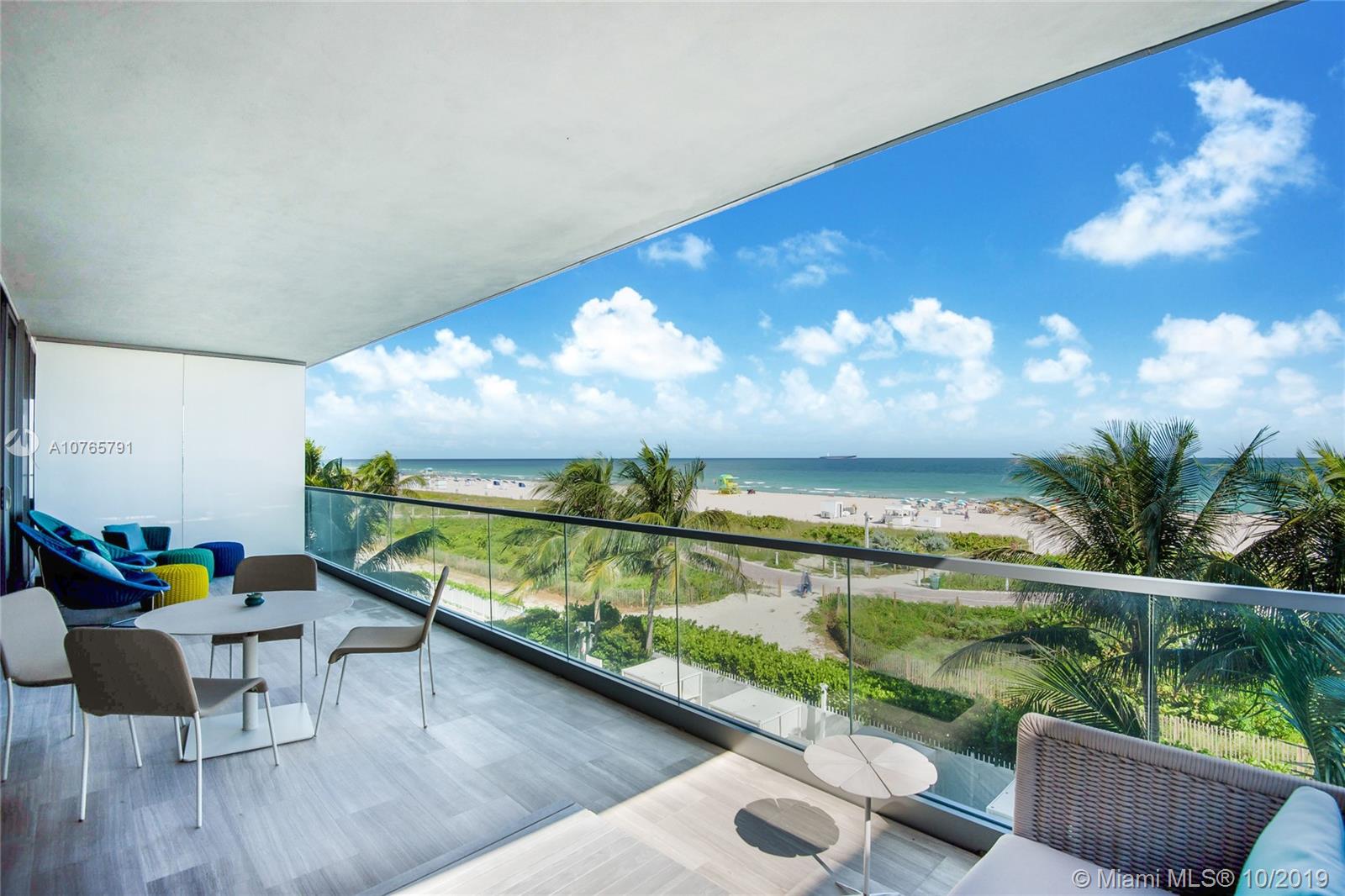This stunning 4/4.5+ Den unit is accessed via a private elevator. High ceilings, floor-to-ceiling glass windows & 10' deep terraces with direct ocean views. Open gourmet kitchen with sleek Poggenpohl cabinets, Gaggenau & Sub Zero appliances. Wood floors throughout. Signature amenities include beachfront infinity pool, jacuzzi, library/lounge, fitness center, beach service, 24 hour valet, concierge and security. Designed by renowned architect Enrique Norton. Walking distance to all the best restaurants.