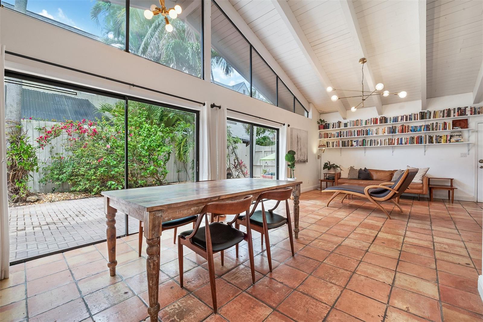 Charming Villa in the Heart of Coconut Grove! Nestled in a prime location, this rare single-story, 2-bedroom villa offers the perfect blend of privacy, charm, and convenience. Featuring vaulted wood beam ceilings and an open floor plan, the home seamlessly extends to a private outdoor yard, creating an airy and inviting space.  Step through large glass French doors onto your spacious patio, which is ideal for entertaining. The kitchen shines with brand-new appliances, while one bedroom boasts a loft space, perfect for a home office or playroom. Enjoy gated living with two assigned parking spaces, all while being just a short stroll from Coconut Grove’s vibrant shops, dining, and parks. With easy access to MIA, downtown Miami, and the beaches, this is Grove living at its finest!