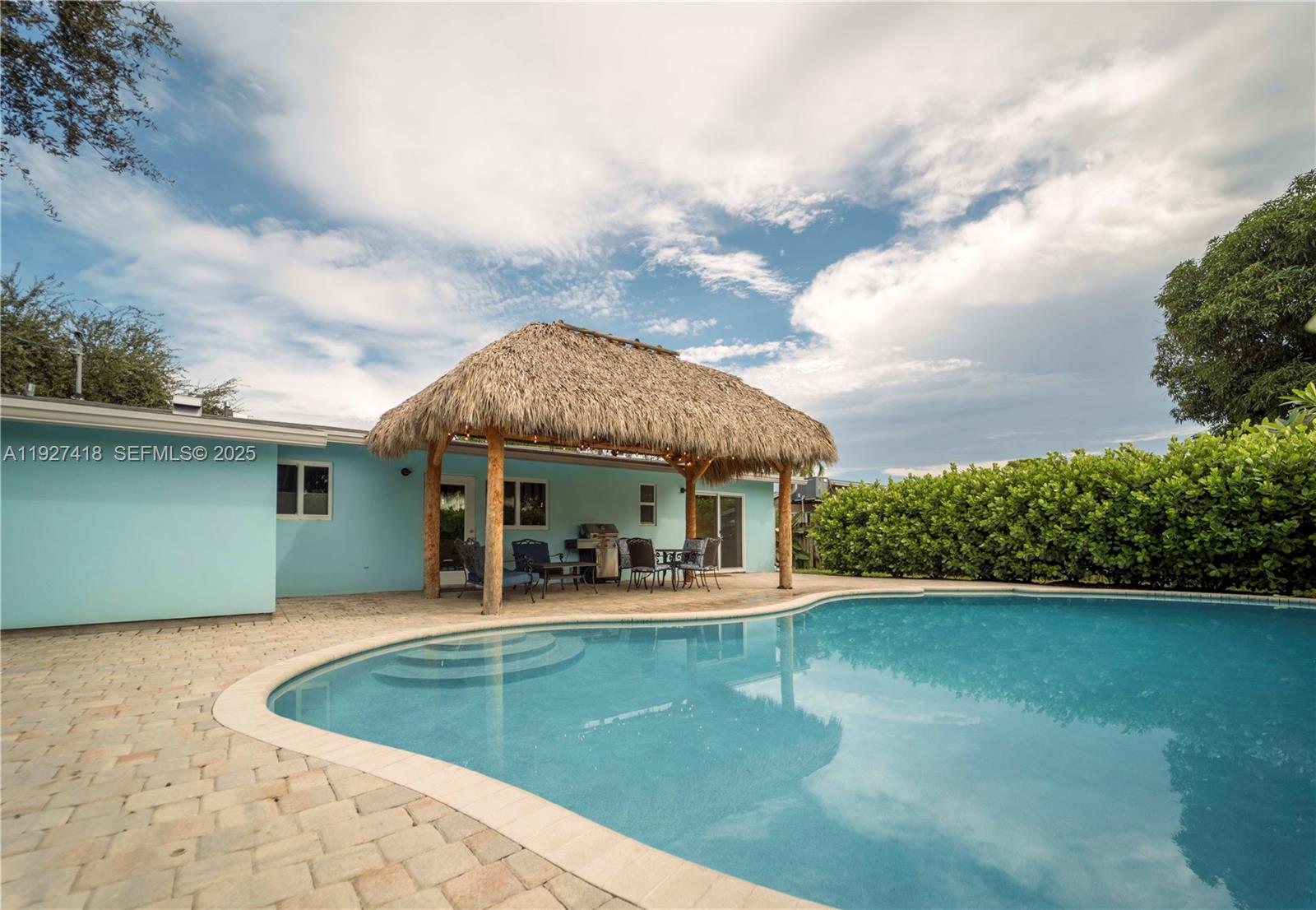 Paradise near the beach is calling your name! This stunning 3/2 completely renovated and fully furnished home with new roof and impact glass is ready for you to call it home or start your short-term rental business. No association approval required or hassle. Home offers screened in front porch, fenced in back yard, pet friendly, saltwater pool, and Tiki Hut for entertaining. Only 1 Mile to the famous Deerfield Beach, Fishing pier, shops, and restaurants. Walk across the street to Starbucks, Publix, and Restaurants. What more can you ask for this home will not last! All furniture is included on the sale