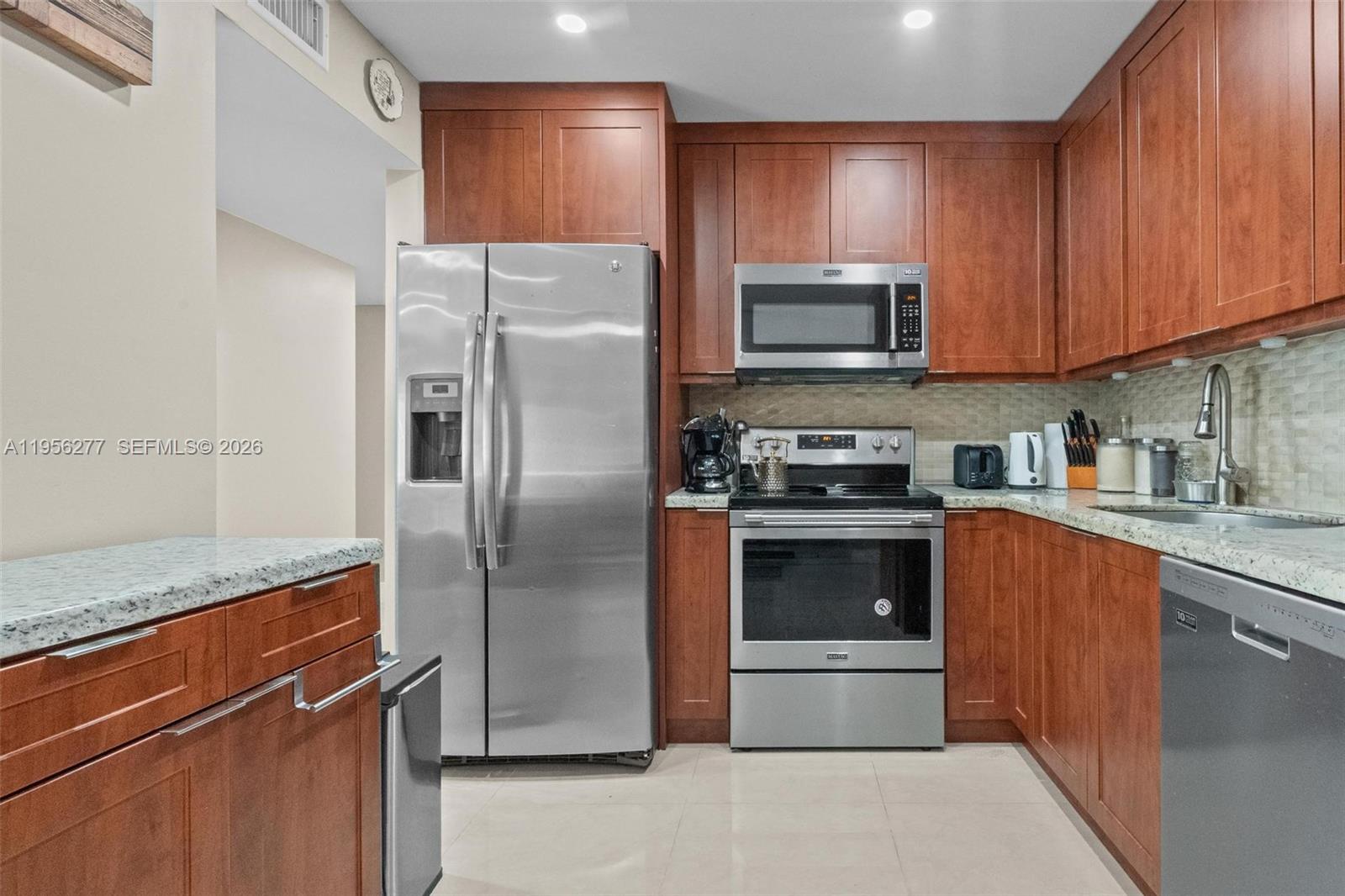 Spacious and upgraded 2-bed, 2-bath corner unit in Willow Walk, Kendall! This 1st-floor garden apartment features 960 SF of living space, tile floors throughout, and a private balcony. Enjoy a remodeled kitchen, granite countertops, and stainless steel appliances, plus modern bathrooms, walk-in closet, and in-unit washer/dryer. Plenty of guest spaces. Quiet, well-maintained community w/pool. Ideal location—walking distance to shopping center, 3 min away from Costco, public transportation, and just minutes from Miami Dade College, London Square, and the Turnpike. Rented until Dec 2025—great for investors!
