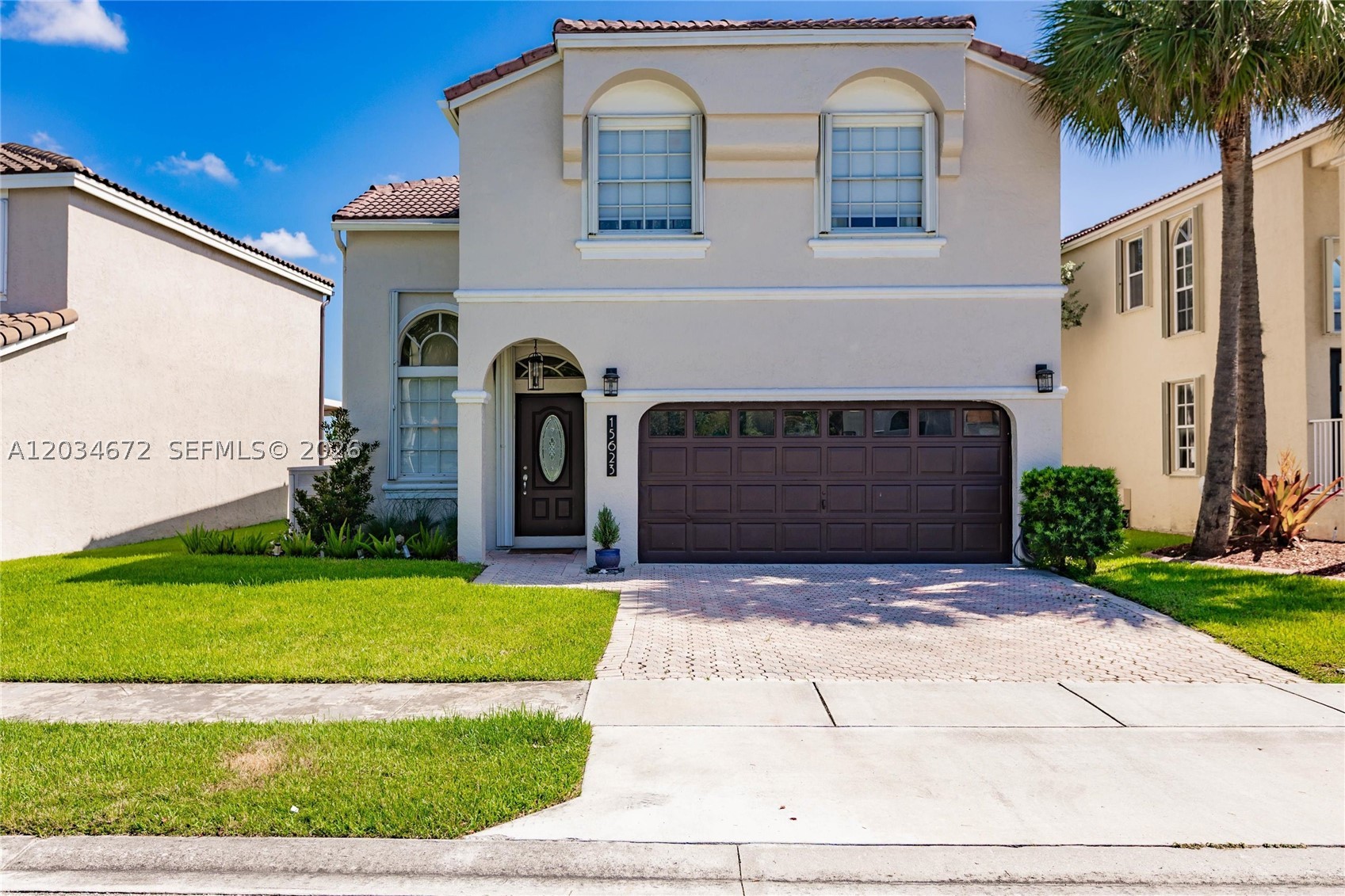 Nestled on a serene lakefront lot in the highly desirable Mahogany Way community, this fully remodeled four-bedroom, two-and-a-half-bathroom home with a two-car garage offers the perfect blend of luxury, comfort, and style.
As you enter, you're welcomed by soaring volume ceilings and a striking offset staircase that leads to the spacious upstairs living quarters. The open-concept living and dining areas are ideal for entertaining, while breathtaking views of the sparkling pool and tranquil lake create an immediate sense of relaxation.
The beautifully updated kitchen is a chef's dream, featuring abundant cabinetry, quartz countertops, a spacious cooking island, and a custom-designed range hood. Enjoy preparing meals while overlooking the pool and waterfront scenery.
Upstairs, the generous primary suite provides a private retreat complete with a walk-in closet and a bathroom featuring a soaking tub, and separate shower. The three additional bedrooms are spacious and feature blackout shades. 
Additional features include: Screened-in saltwater pool and patio area, Expansive paved outdoor entertaining space, Accordion hurricane shutters, Barrel tile roof, Volume ceilings, Quartz countertops, fully remodeled interior, Scenic Lake views, Two-car garage.
Whether you're enjoying peaceful waterfront sunsets or entertaining , this exceptional home offers the Florida lifestyle you've been dreaming of. Come see for yourself!