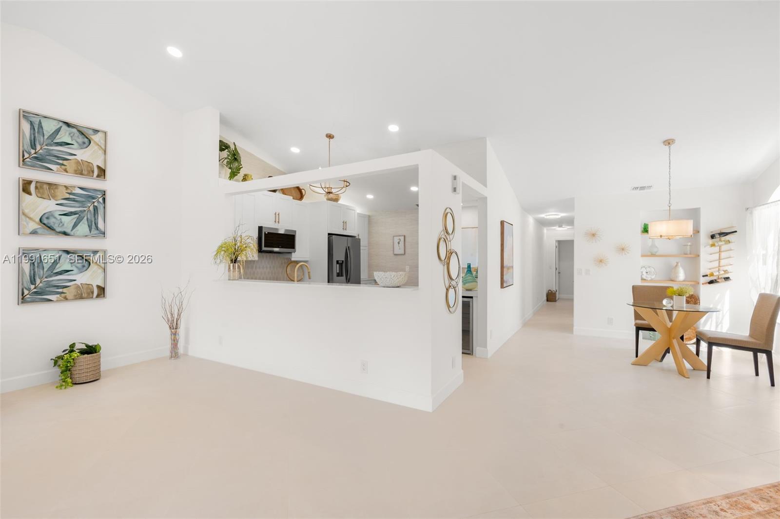LOOKING TO LIVE AND ENJOY A FULLY PROFESSIONALLY UPDATED THREE BEDROOM HOME IN THE HEART OF DELRAY BEACH? YOU FOUND IT! THIS AMAZING HAVEN HAS NEWER ROOF (2021), A/C AND LOCATED ON A QUIET END STREET WITH GORGEOUS LAKE VIEWS. BRAND NEW STATE OF THE ART KITCHEN HAS CUSTOM CABINTERY, STAINLESS APPLIANCE PACKAGE, WASHER/DRYER, AND EVEN A WINE BAR CENTER! HUGE OPEN FLOORPLAN, NEUTRAL TILE THROUGHOUT AND A PRIMARY BATHROOM WITH A SPA DESIGN! CUSTOM CLOSETS THROUGHOUT. LARGE ONE CAR GARAGE WITH ADDITIONAL STORAGE/WORKSPACE. CUSTOM LIGHTING THROUGHOUT. HUGE ENCLOSED PATIO THAT ALSO HAS A PAVERED EXTENSION PERFECT FOR GRILLING AND SUNSET VIEWS. UPSCALE RESORT COMMUNITY FEATURES CLUBHOUSE, TWO POOLS, BOCCI, PICKLEBALL, TENNIS, SHOWS, ENTERTAINMENT AND MUCH MORE! ONLY MINUTES TO DELRAY MARKETPLACE, DOWNTOWN ATLANTIC AVENUE AND THE BEST BEACHES! LOVELY WALKING PATHS, FITNESS CENTER AND A VARIETY OF CLUBS AND CLASSES. MILLION DOLLAR CUSTOM DESIGNER HOME JUST MOVE IN READY!